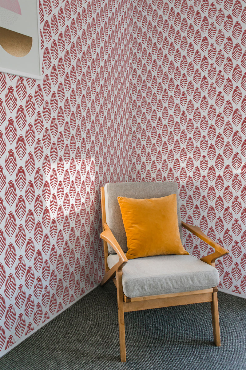 A room with wallpaper patterned with red peacock feathers on a white background, creating a bold and intricate design, traditional wallpaper.