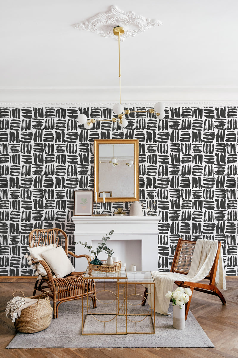 Black brushstroke pattern on a white background creates a modern and artistic feel in the room, while maintaining a timeless elegance with traditional wallpaper.