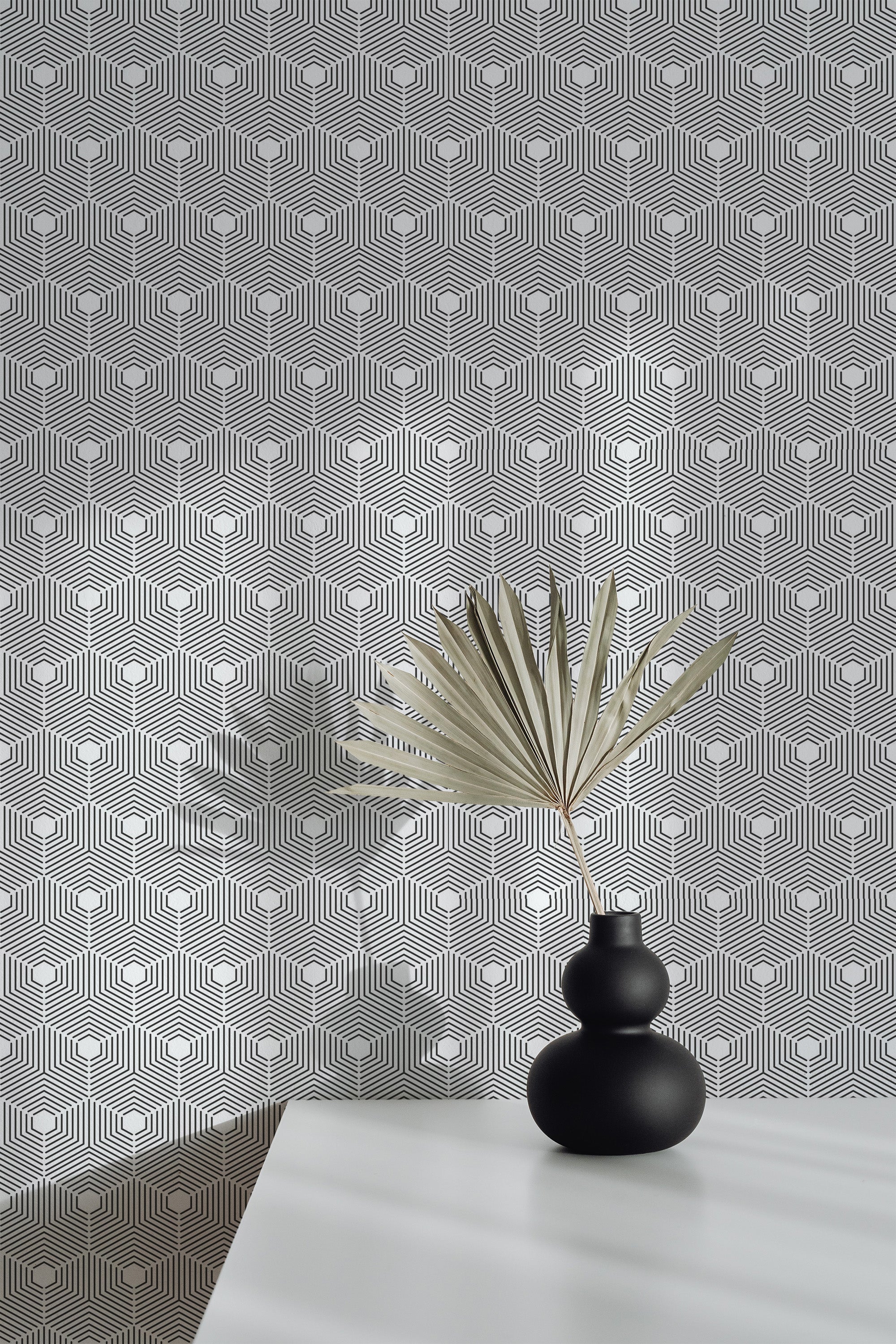 Self-adhesive wallpaper with a seamless hexagon pattern in black and white, creating an intricate geometric design. The background alternates between light and dark tones, enhancing the three-dimensional illusion.