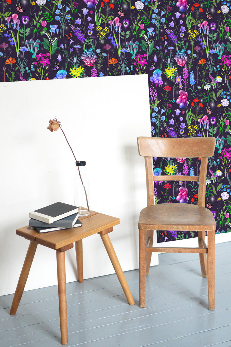 Self-adhesive wallpaper with a Magic Mushrooms design, illustrating vibrant, multicolored mushrooms, wildflowers, and foliage on a dark background, creating a whimsical and enchanting atmosphere.