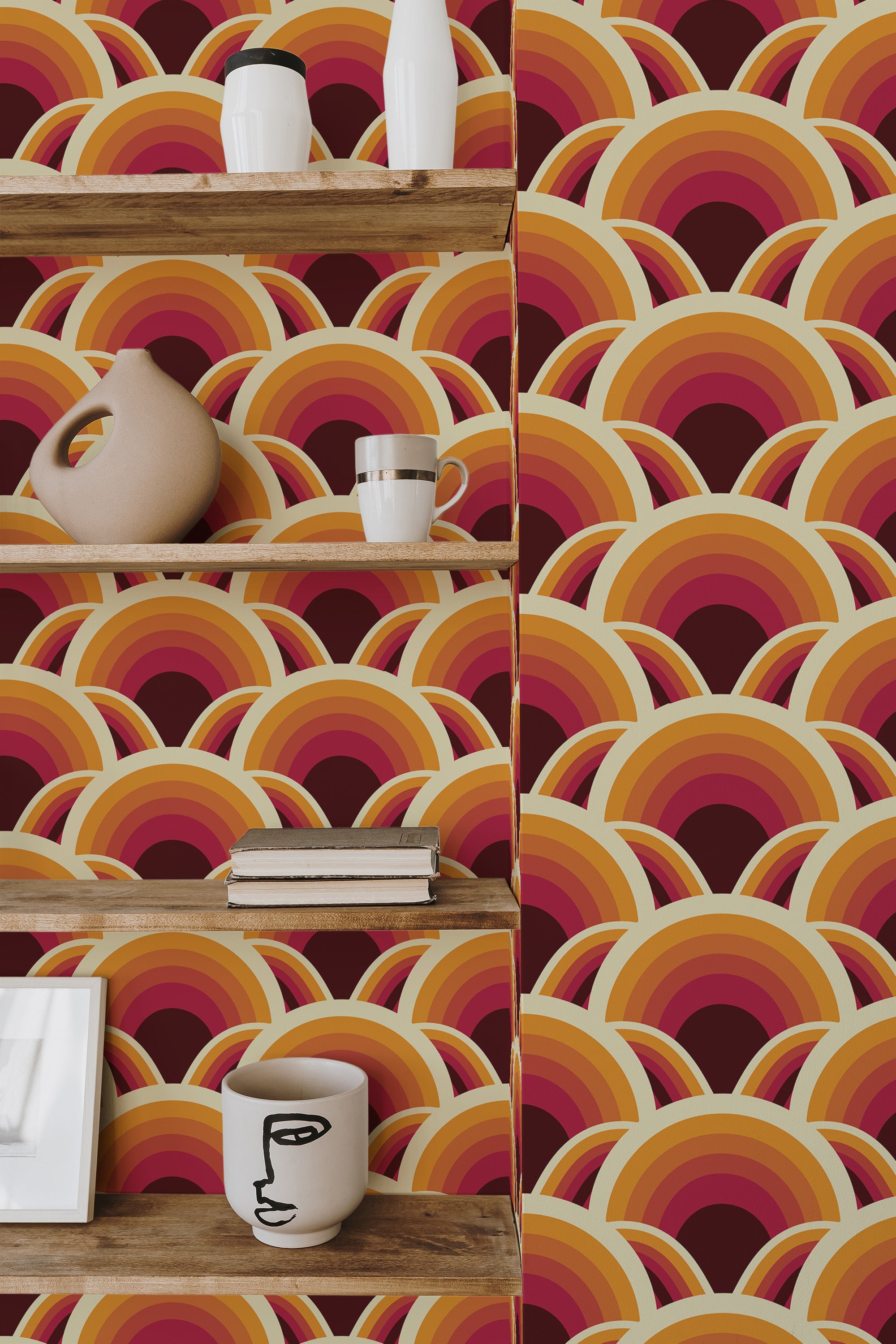 Self-adhesive 70s retro wallpaper with bold, overlapping arches in shades of orange, red, yellow, and maroon, creating a vibrant and nostalgic geometric pattern.