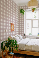 A room with wallpaper design in a thick plaid pattern of muted beige and white tones, giving it a warm, cozy feeling, traditional wallpaper.