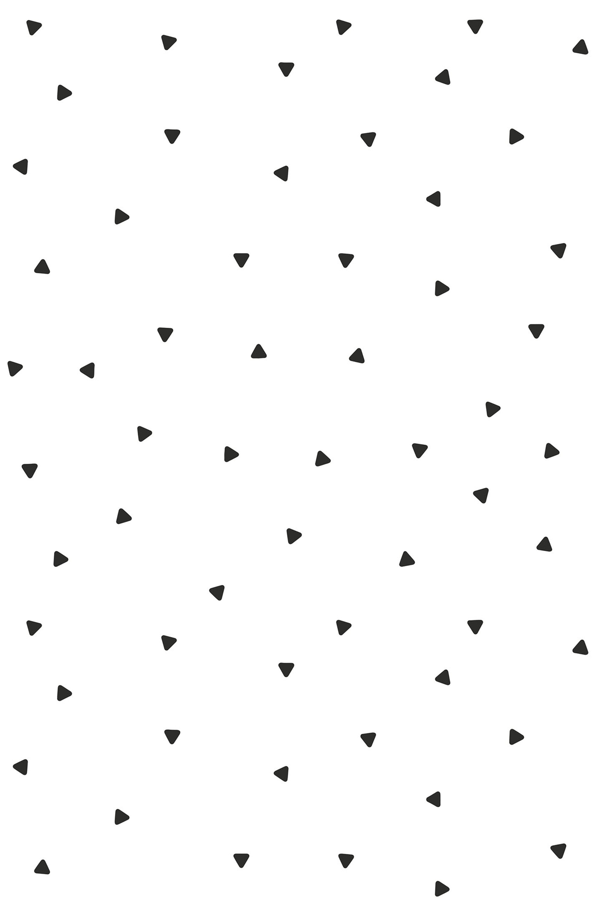 Black minimalist triangles are scattered randomly on a white background, creating a simple and modern geometric pattern. Peel and stick removable wallpaper.