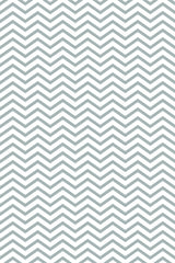 A repeating geometric pattern with zigzagging lines creates a chevron design in a soft gray color on a white background. Peel and stick removable wallpaper.