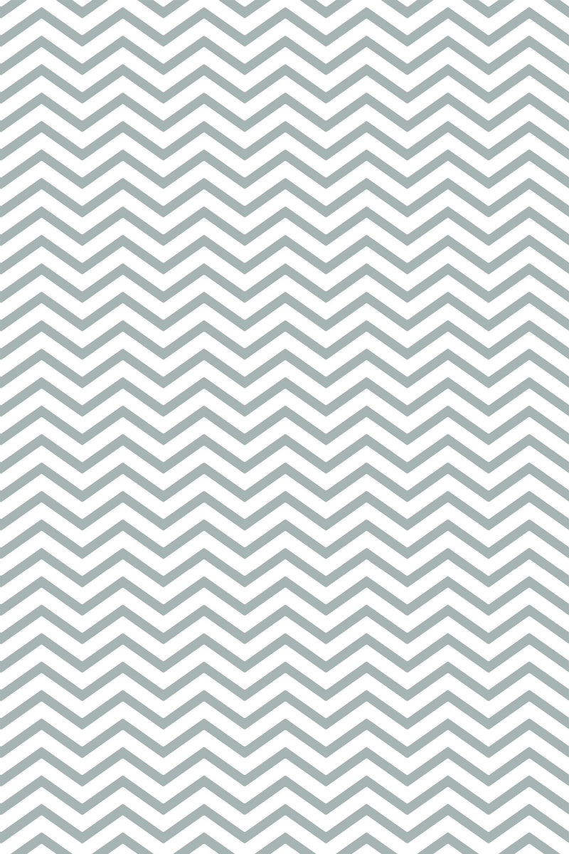 A repeating geometric pattern with zigzagging lines creates a chevron design in a soft gray color on a white background. Peel and stick removable wallpaper.