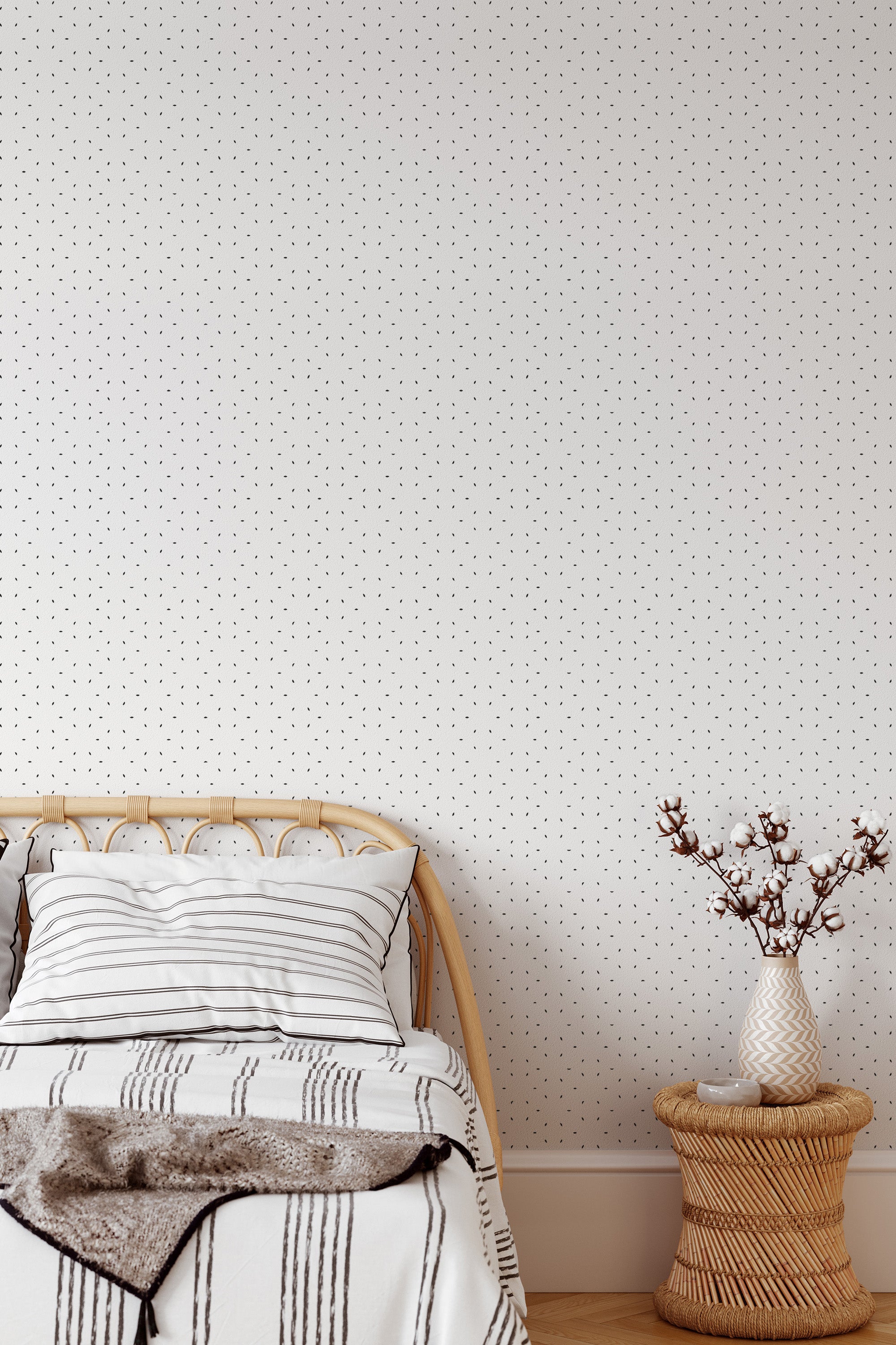 Self-adhesive wallpaper with a minimal star pattern consisting of tiny black stars evenly spaced on a white background, adding a subtle and modern touch to the room.