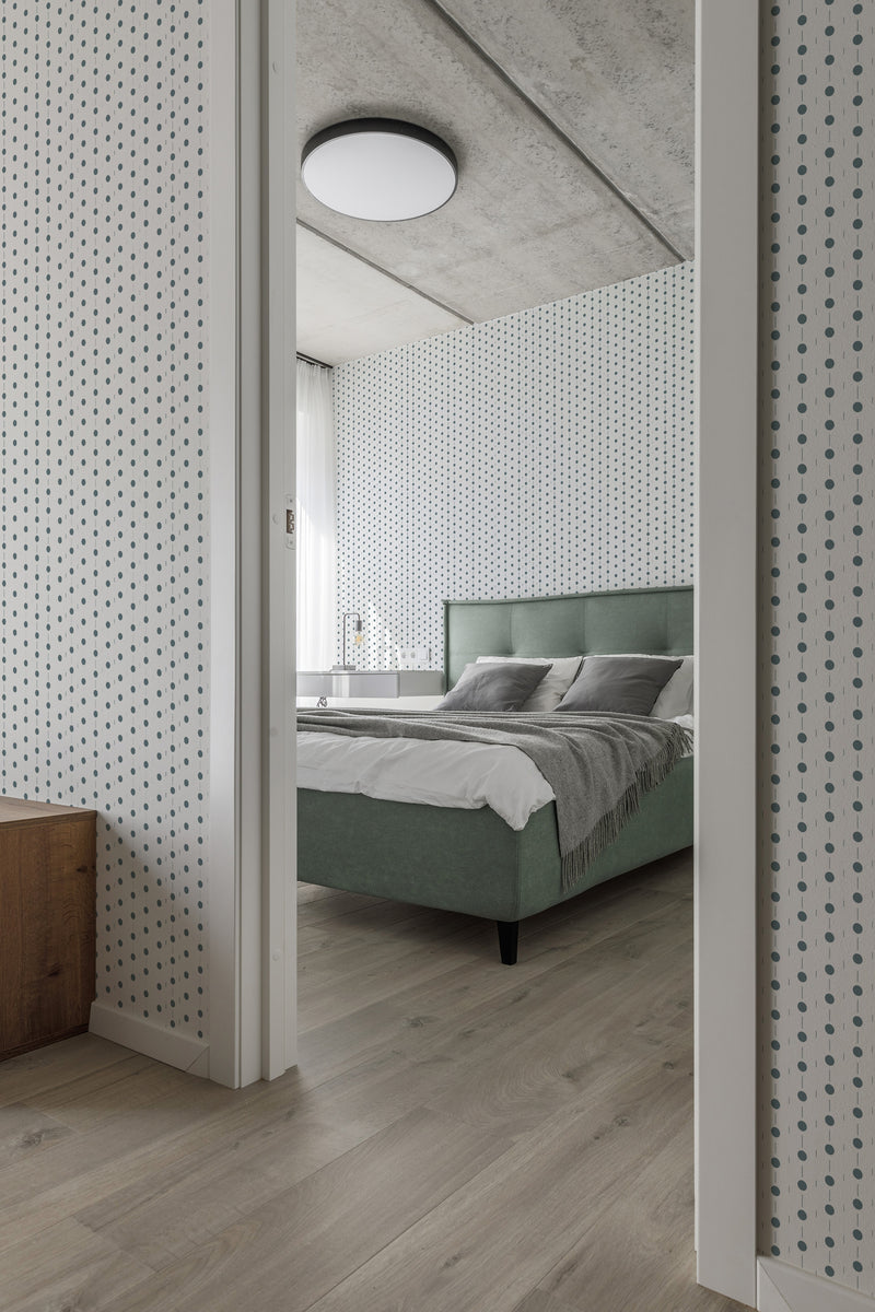 A room with wallpaper featuring a geometric circle line pattern in black on a white background. The wallpaper creates a minimalist and modern aesthetic while maintaining the timeless appeal of traditional wallpaper.