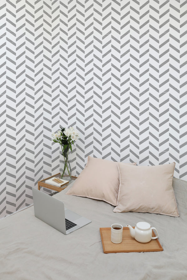 temporary wallpaper striped herringbone pattern cozy romantic bedroom interior