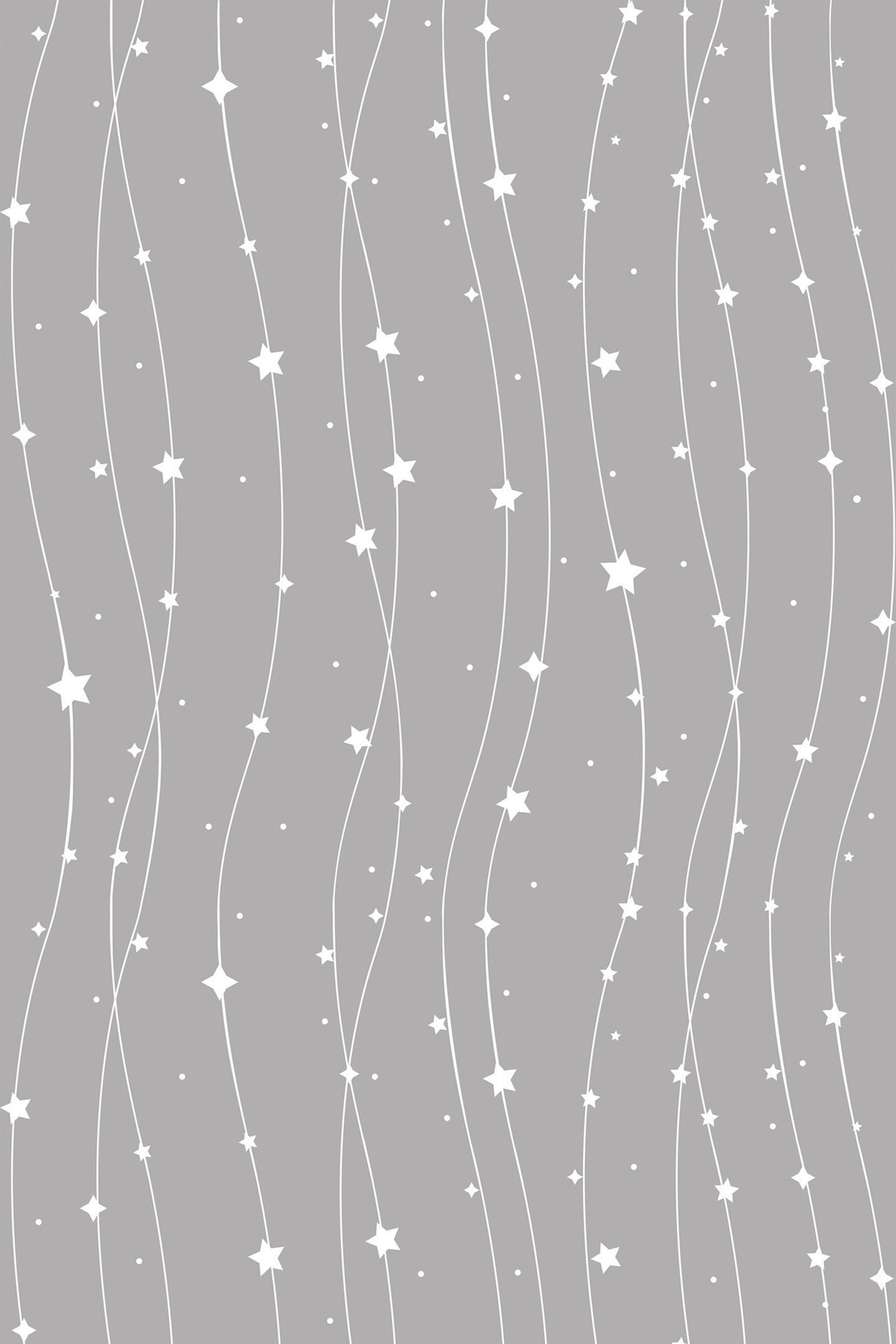 A gray background with vertical wavy lines embellished with various sizes of white stars and small dots, creating a celestial-themed pattern. Peel and stick removable wallpaper.