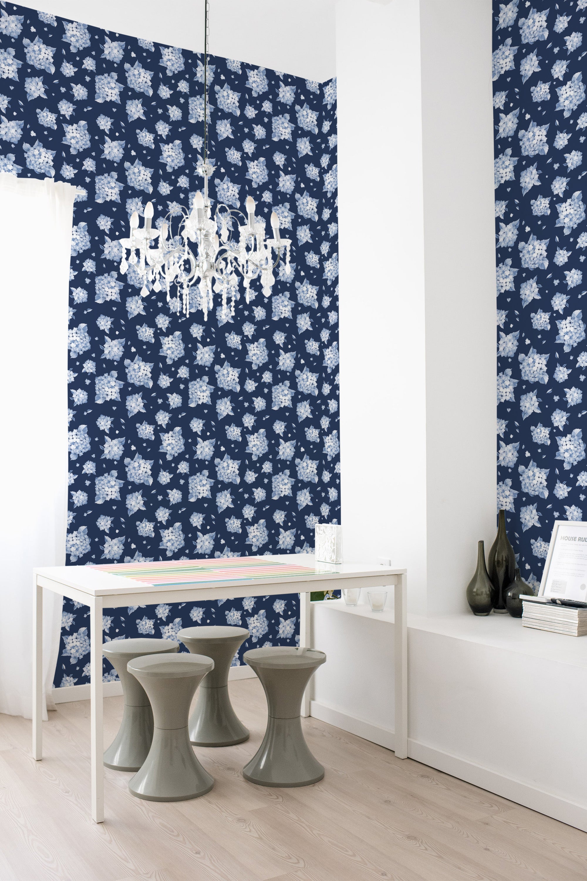 Dark blue wallpaper with a repeating pattern of white floral motifs covering the walls in a contemporary room, embodying the elegance of traditional wallpaper.