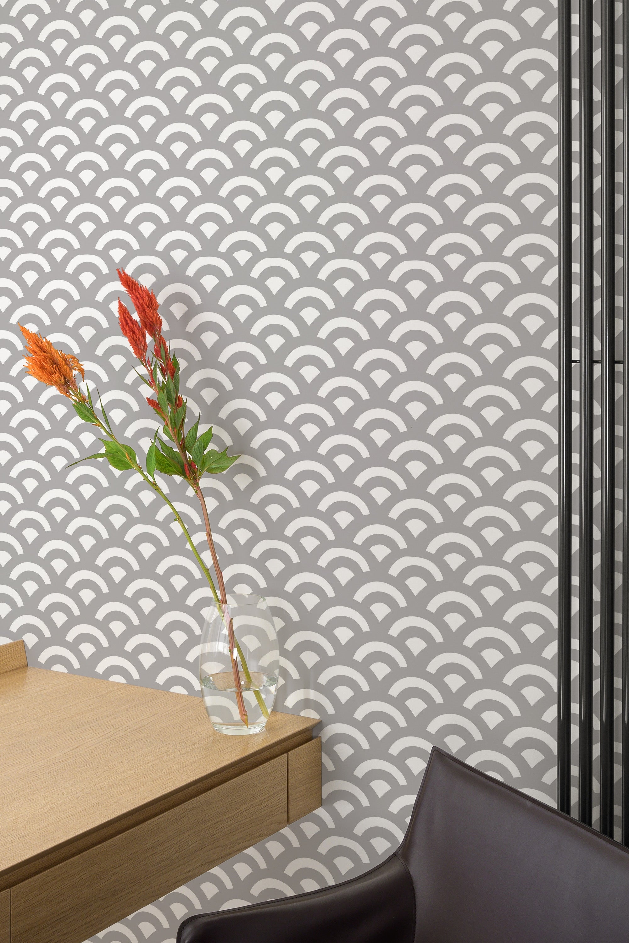 Self-adhesive wallpaper with an Art Deco double wave pattern in a repeating scallop design, mixing white and gray tones, adds a modern and elegant touch to the room.