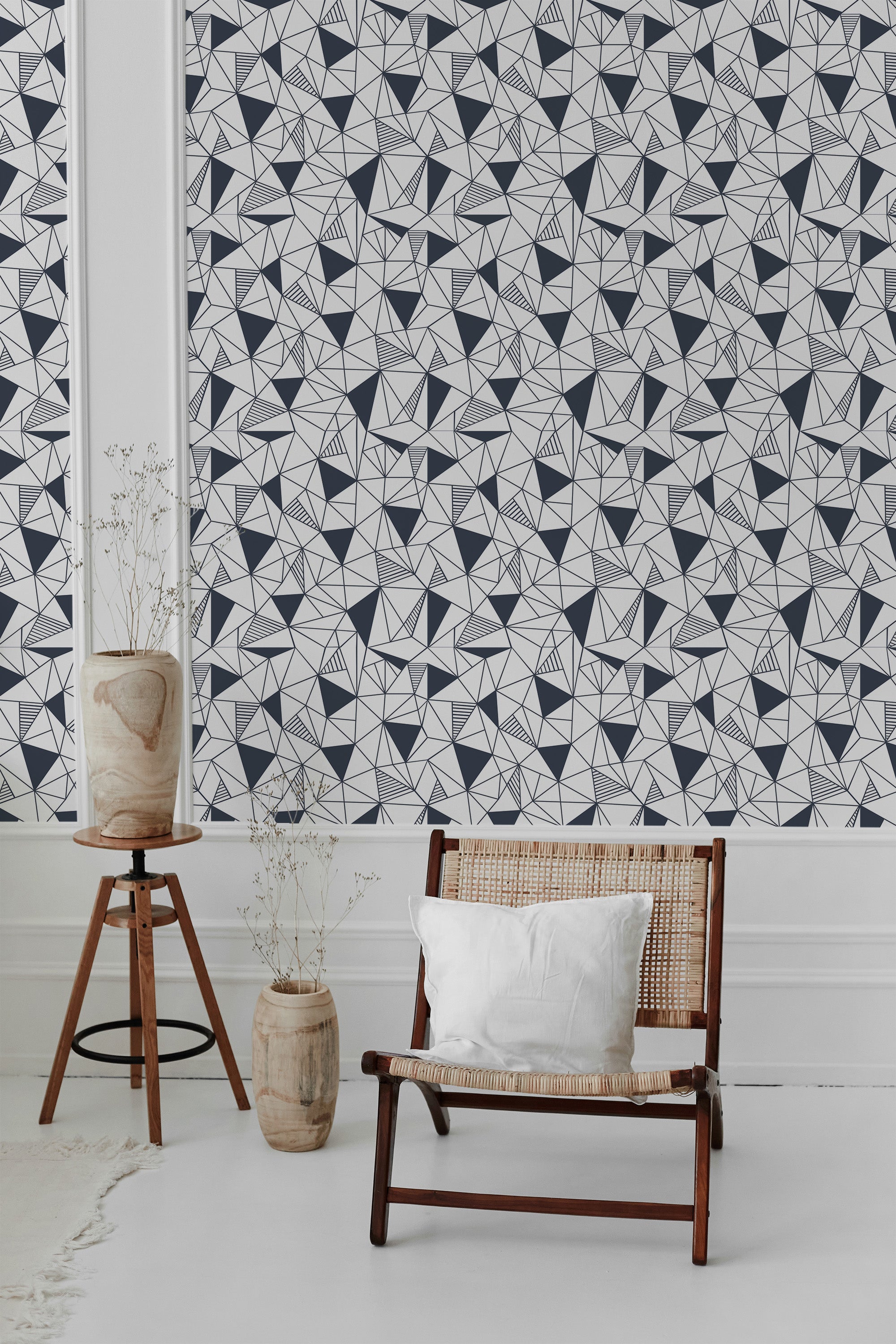 Navy mosaic wallpaper with abstract, geometric patterns made of triangles and diamonds in navy blue and white, creating a striking and modern design. Traditional wallpaper.