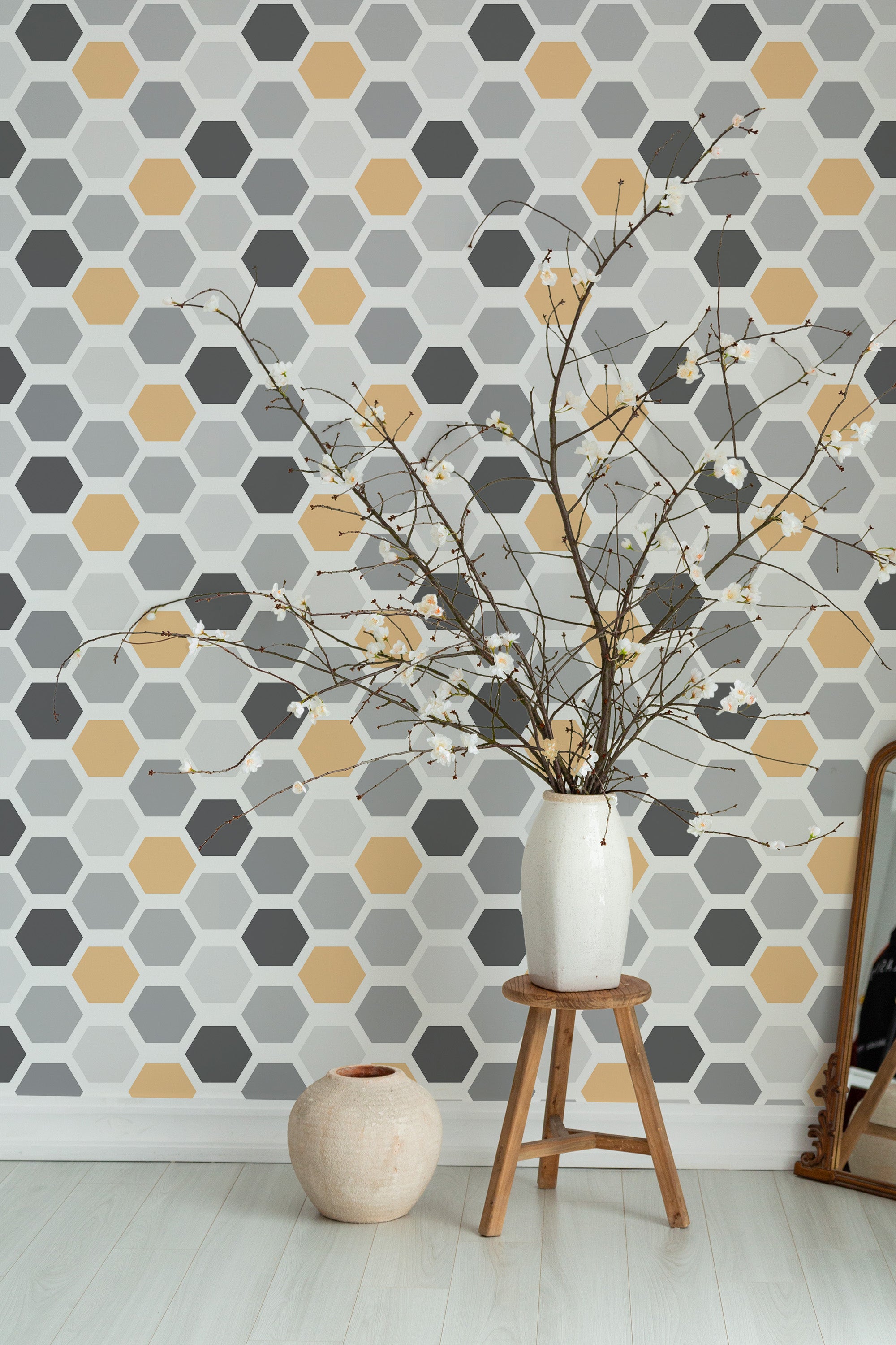 Self-adhesive colorful hexagon wallpaper with a pattern of interlocking hexagons in shades of grey, white, and muted yellow, creating a modern and geometric aesthetic.