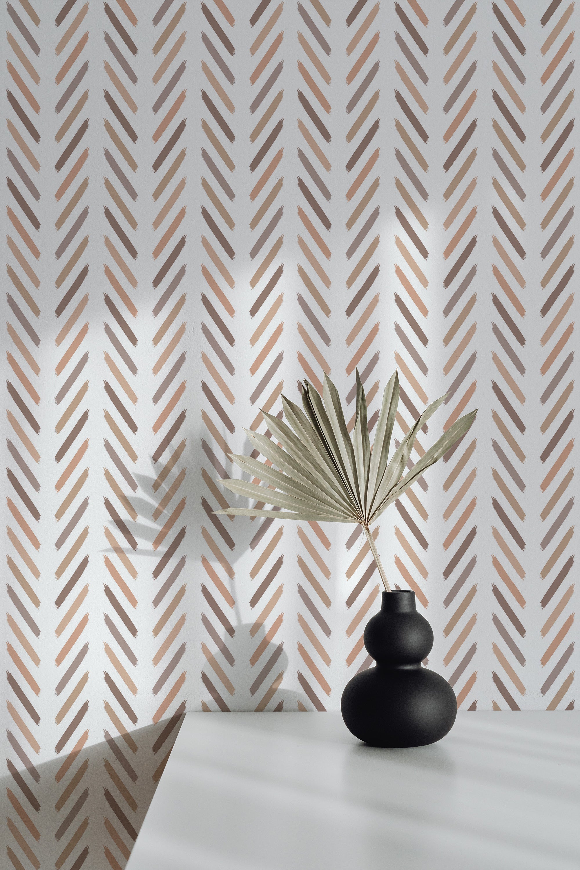 Self-adhesive beige watercolor herringbone wallpaper with soft, diagonal brushstroke patterns creating an elegant and minimalist look, set against a white background.