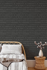 Self-adhesive wallpaper with a black background and scattered short white vertical lines creates a minimalist, modern vibe.