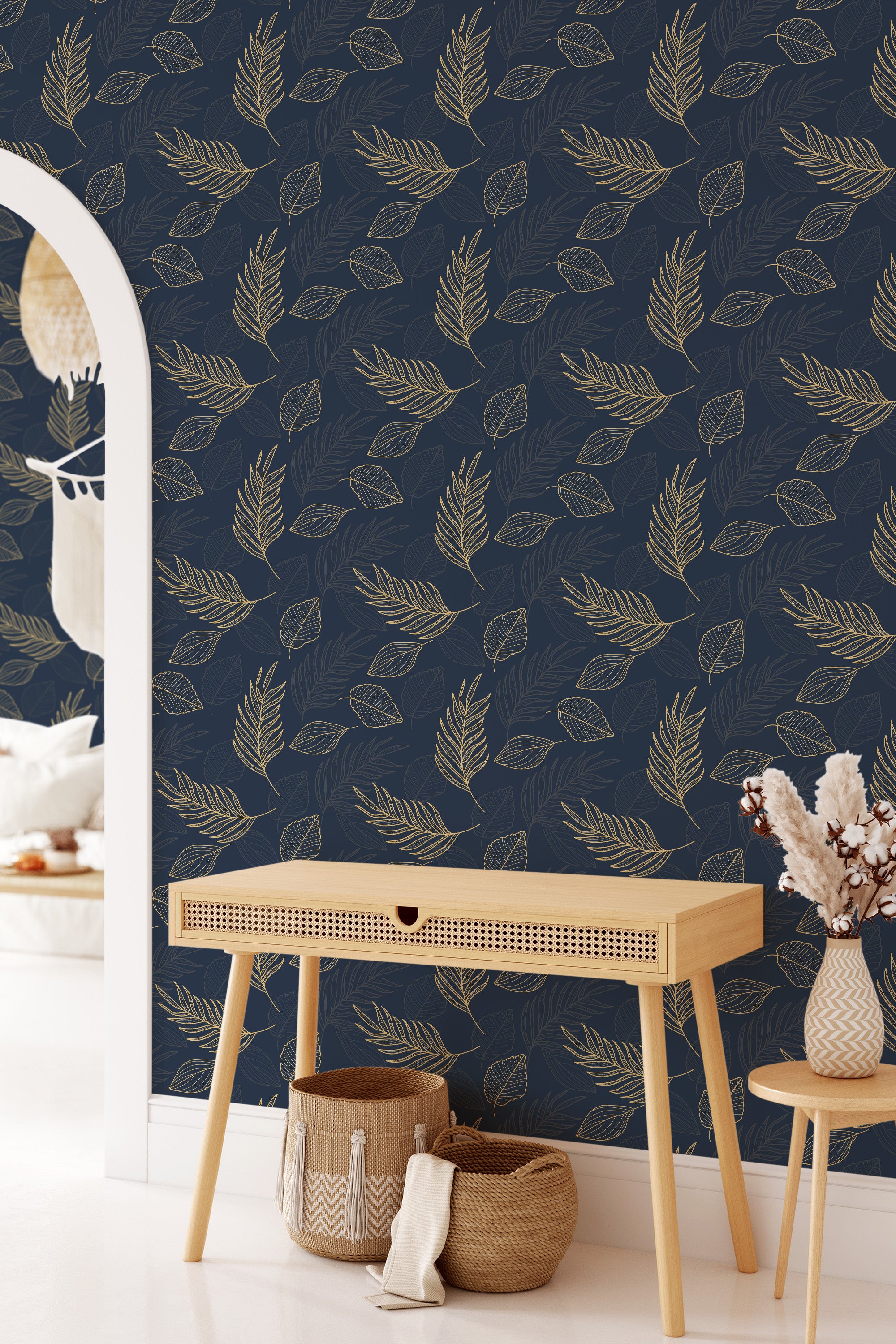 Blue wall embellished with golden leaf patterns arranged in an elegant, symmetrical manner, providing a classic and sophisticated look. Traditional wallpaper.