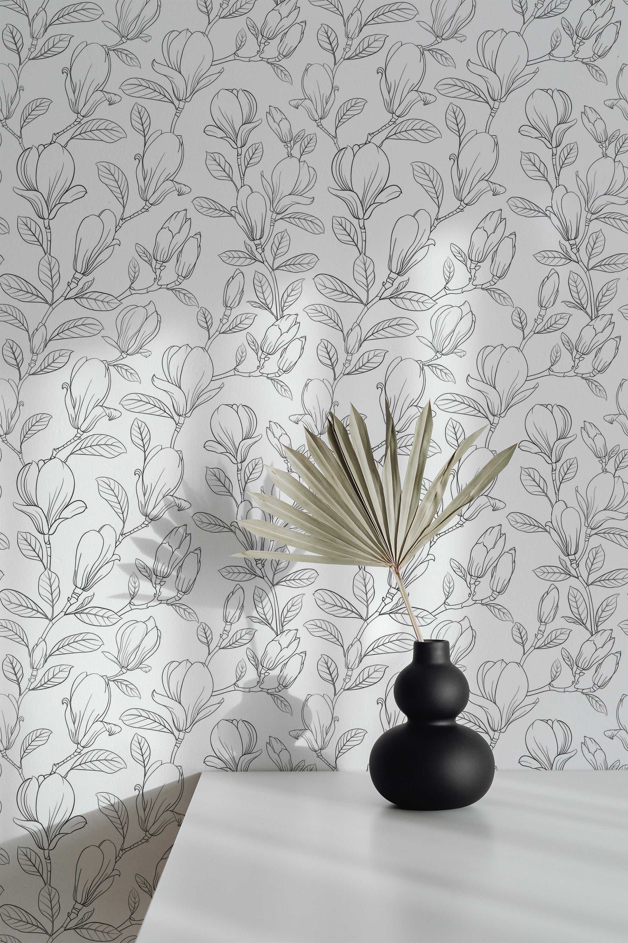 Self-adhesive wallpaper with a seamless minimal floral pattern, featuring delicate line-drawn leaves and flowers in a monochromatic palette. The design creates a subtle, elegant ambiance in the room.
