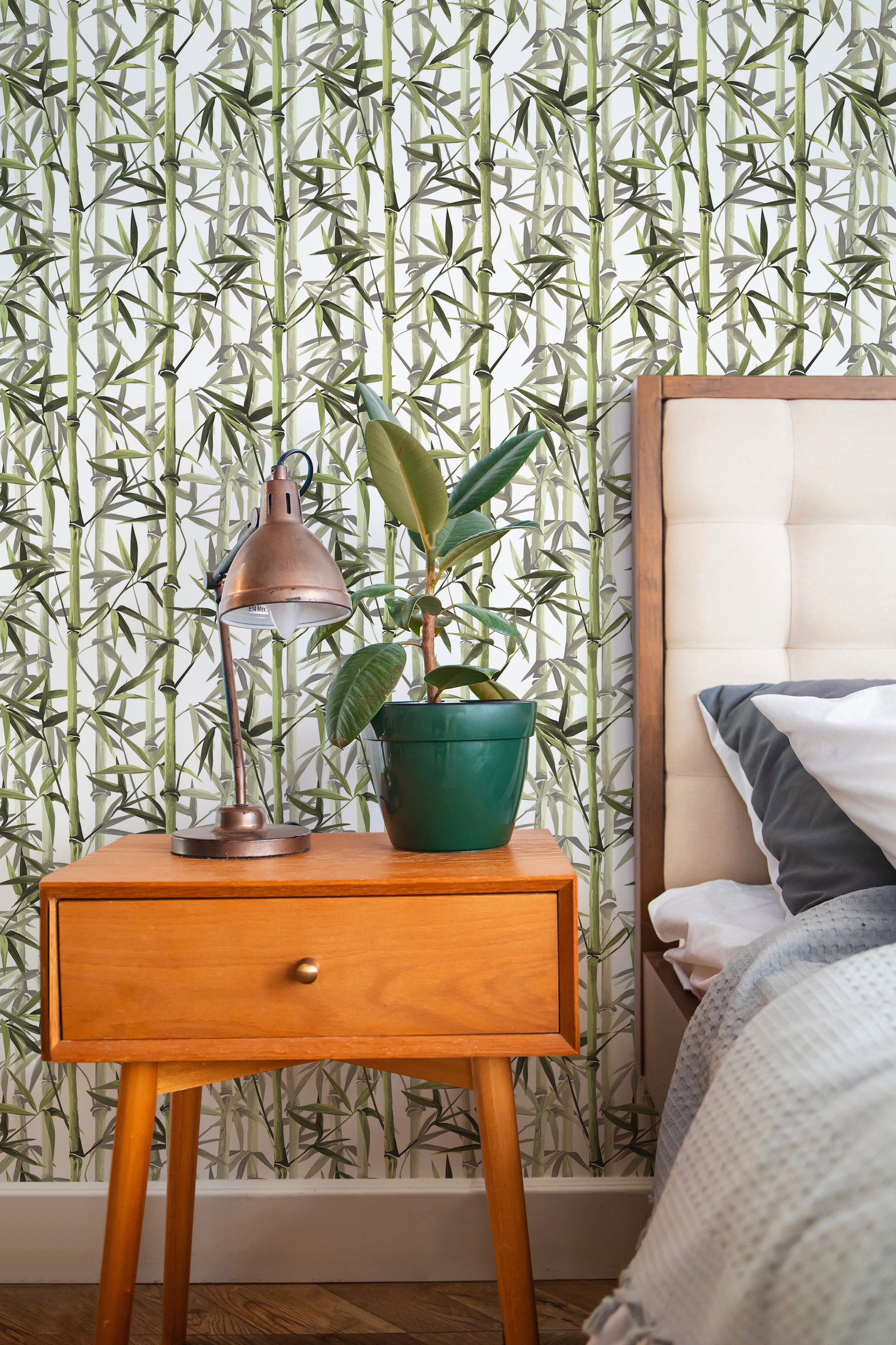 Self-adhesive bamboo tree wallpaper with green bamboo stalks and leaves against a white background.