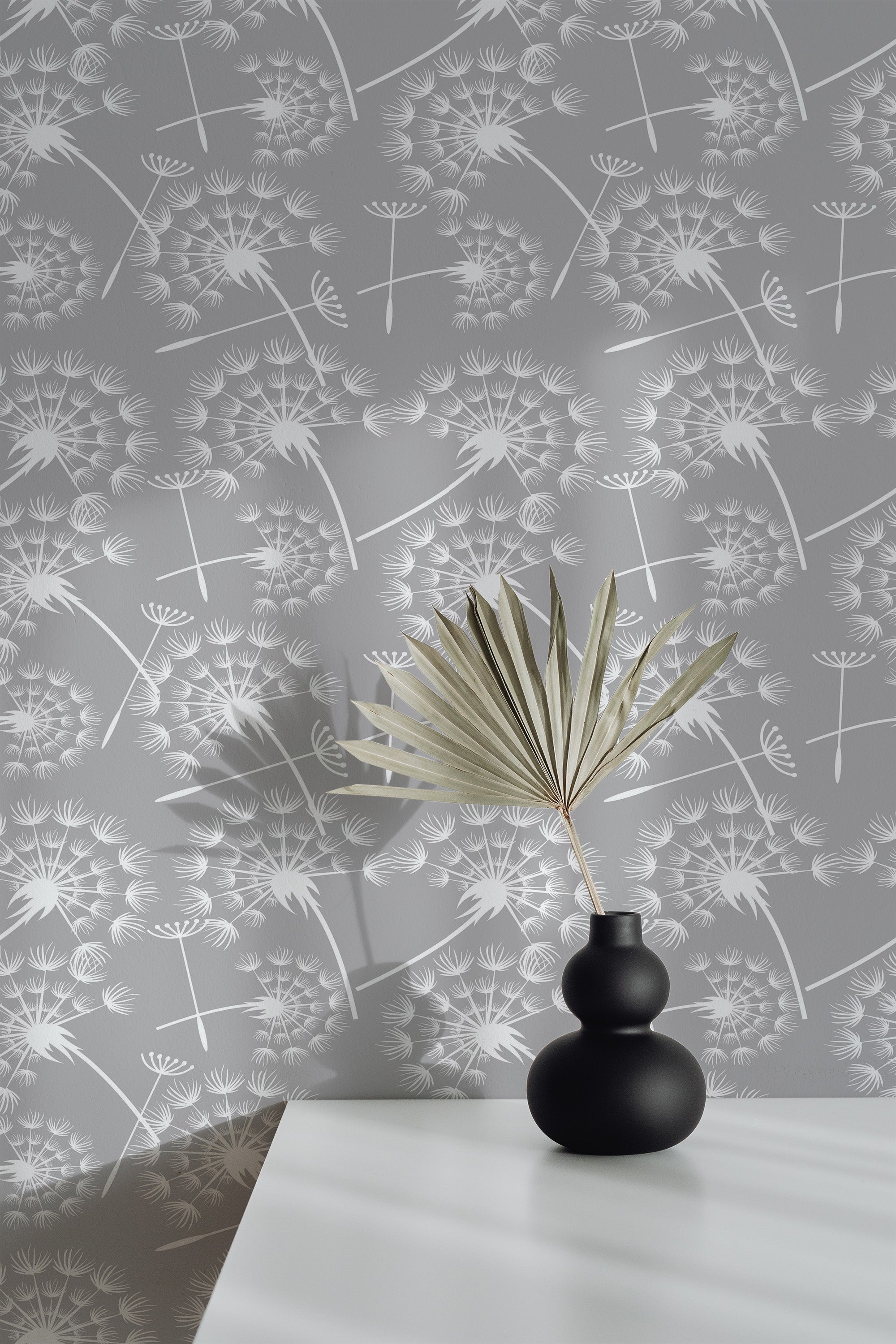 Self-adhesive wallpaper with a seamless dandelion design featuring delicate, white dandelions on a soft gray background, creating a calming and serene atmosphere.