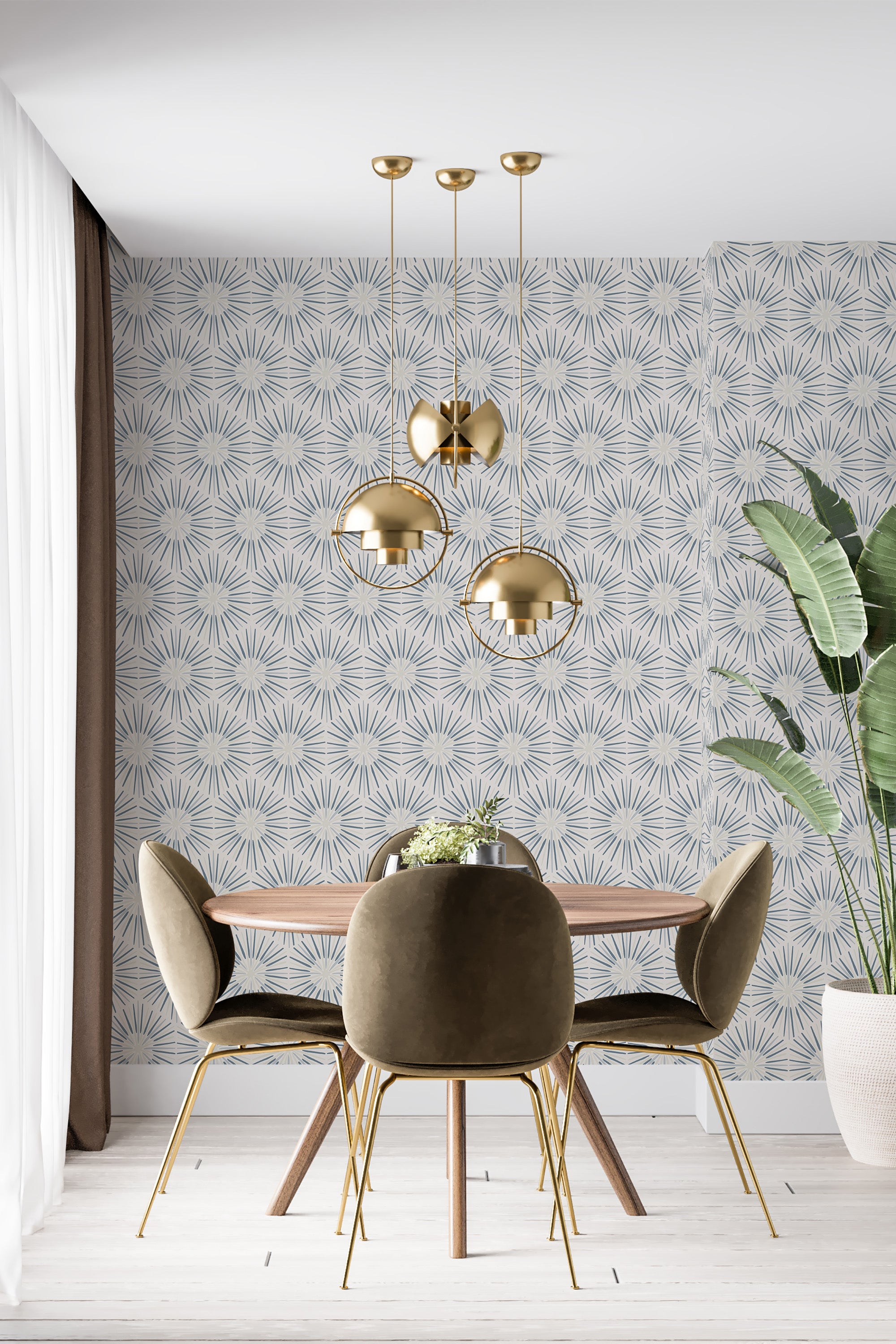 A dining room with a blue starburst pattern wallpaper in light and dark shades of blue, complementing gold accents and mid-century modern furniture. Traditional wallpaper.