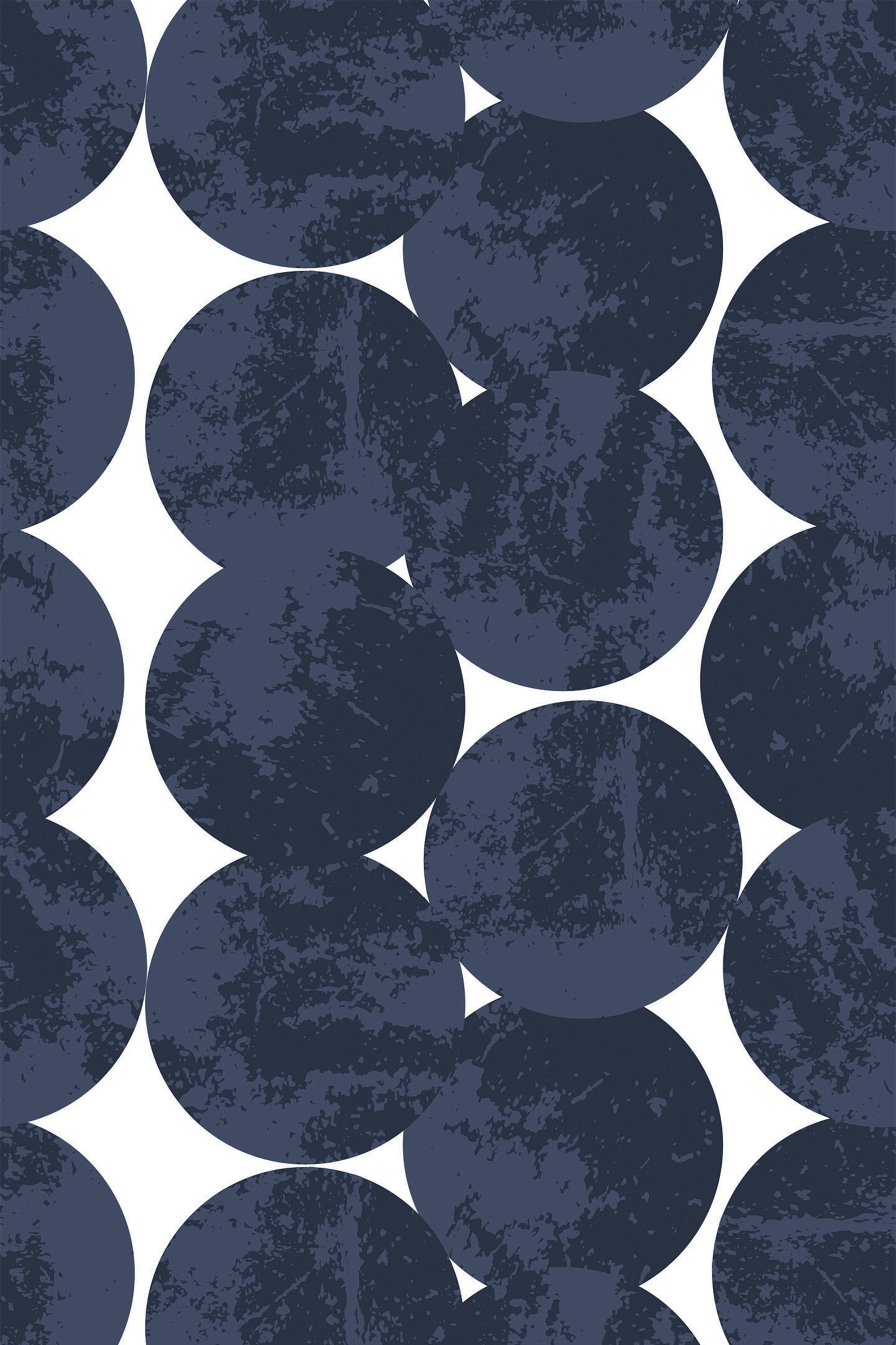 Navy blue circles with a textured appearance are arranged in a staggered pattern against a white background, creating a modern, abstract design. Peel and stick removable wallpaper.