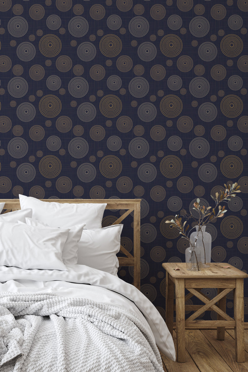 Self-adhesive wallpaper with a retro blue circle pattern, featuring concentric circles in shades of gold and brown against a dark blue background, adding a vintage and modern aesthetic to the room.