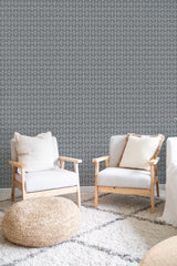 cozy living room soft armchairs pillows geometric grid wall decor