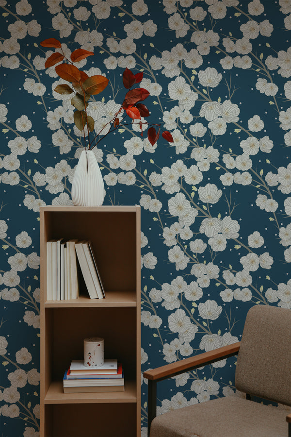 self-adhesive wallpaper dark blue floral pattern bookshelf armchair decorative plant interior