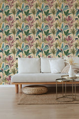 Wallpaper with a tropical design including monkeys, large green leaves, and exotic plants in shades of purple and beige on a pale background. Traditional wallpaper.