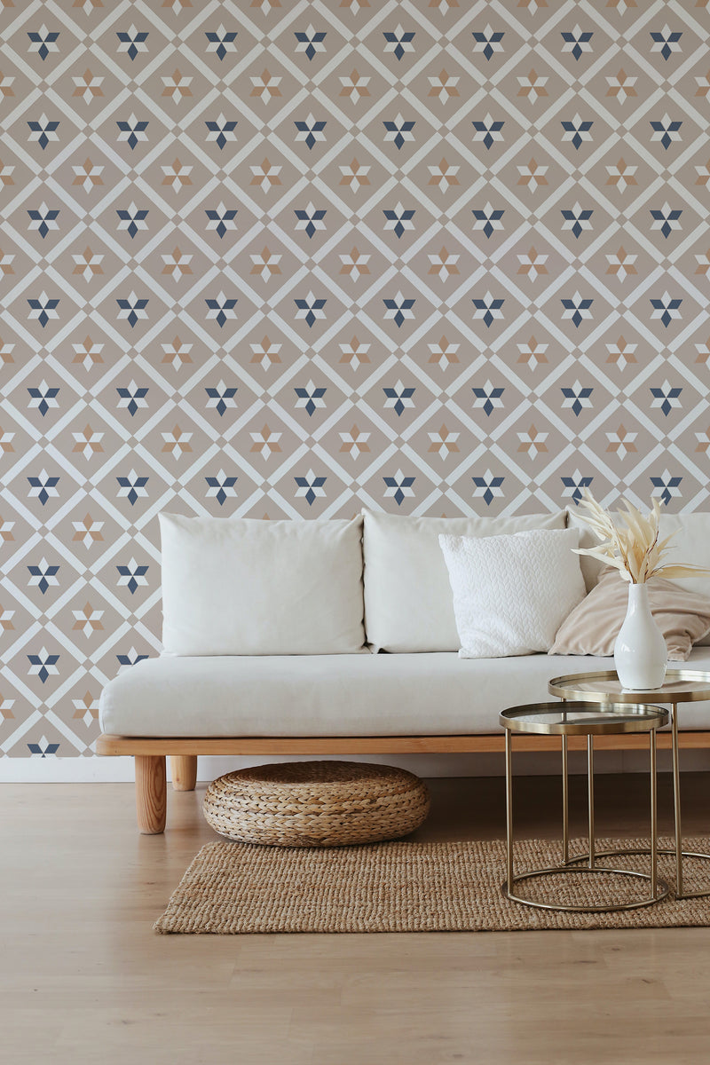 Room with French tile design wallpaper, featuring beige and white symmetrical patterns with small blue accents, giving a classic and traditional wallpaper feel.