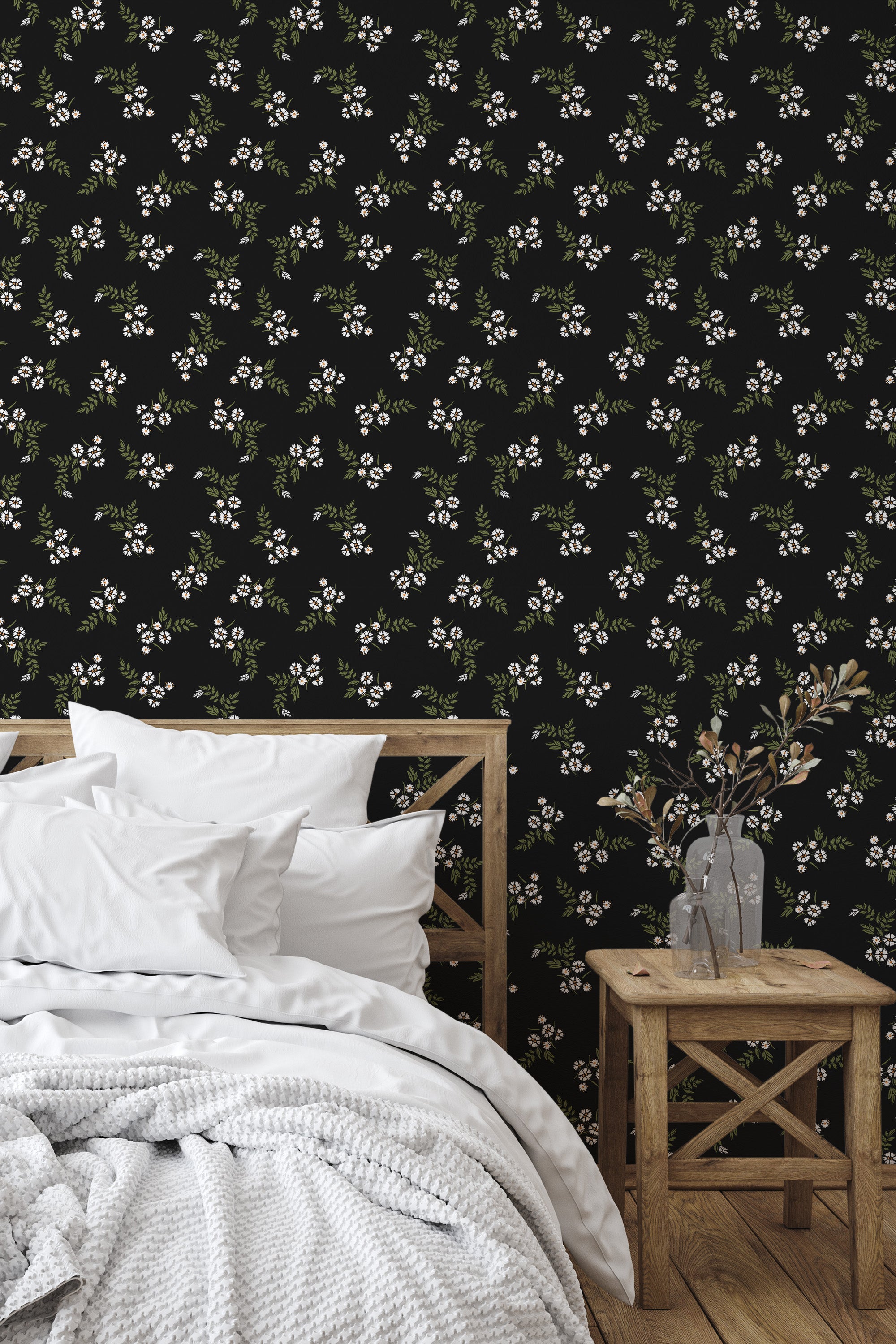 Self-adhesive wallpaper with small white flowers and green leaves on a black background, adding an elegant and subtle floral pattern to the room's decor.