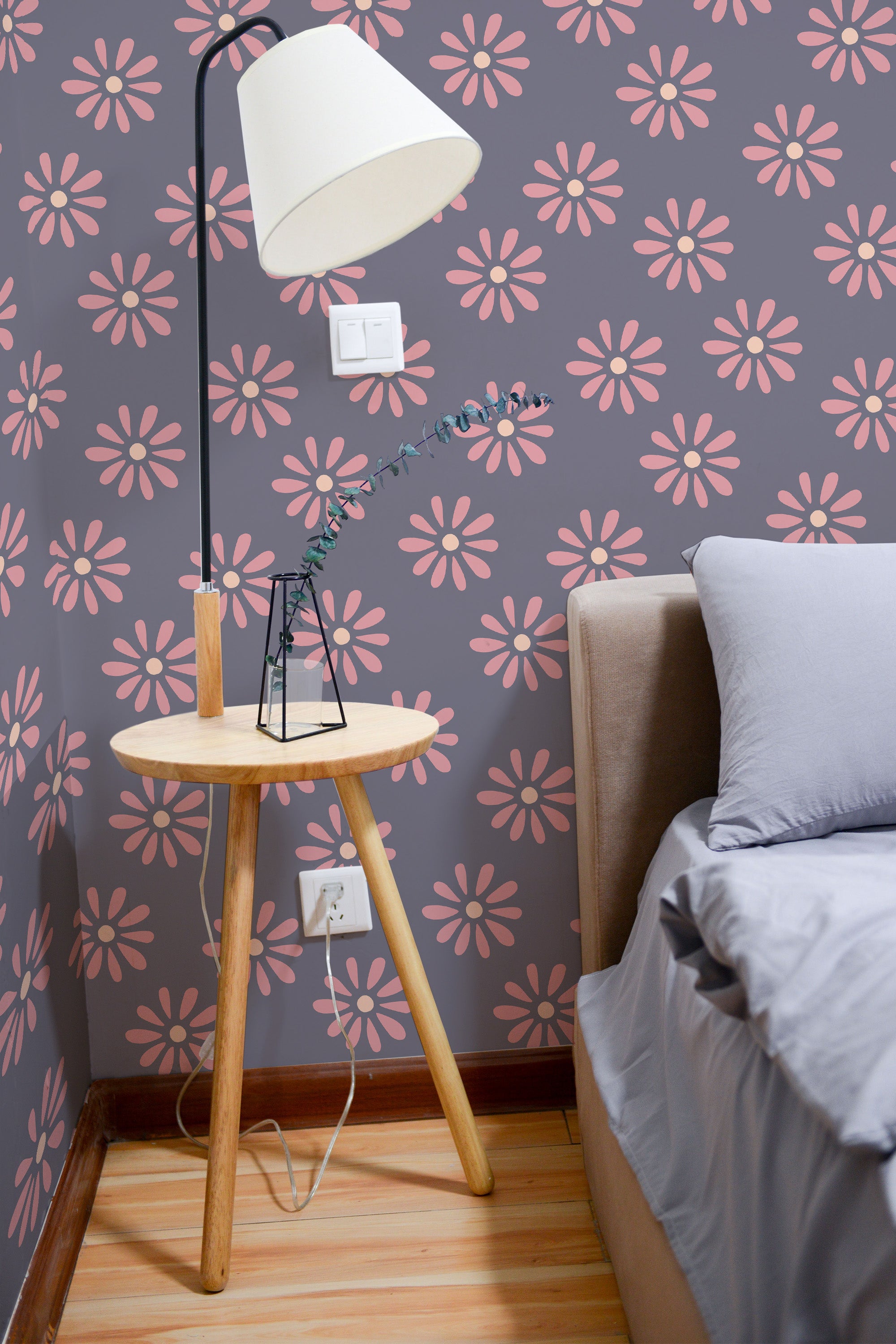 Self-adhesive wallpaper with a purple background and a repeating pattern of pink floral designs, adding a vibrant and cozy atmosphere to the room.