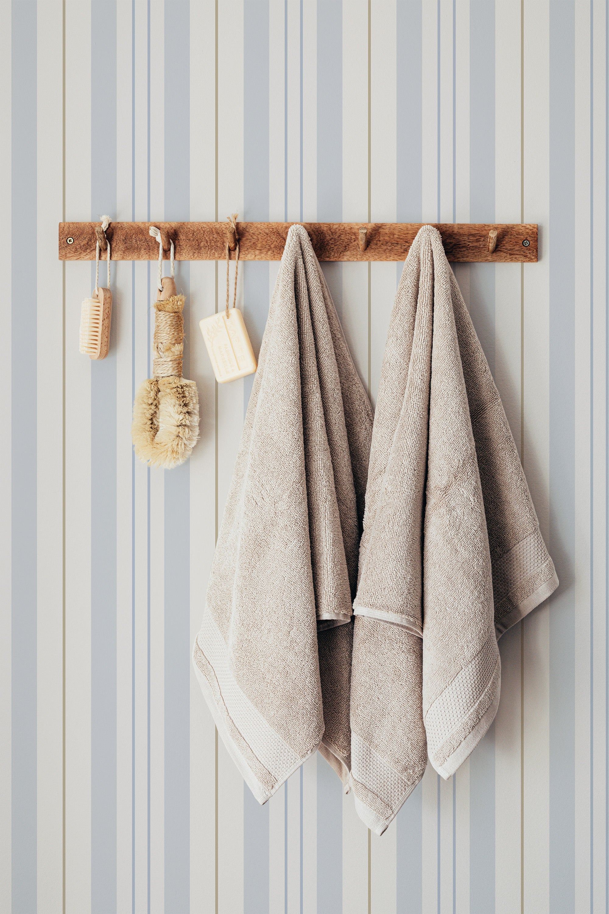 Self-adhesive Retro stripe wallpaper in soft blue and beige tones with vertical lines creating a soothing pattern.