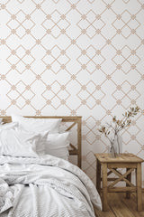 Self-adhesive wallpaper with minimalist tile dots design in a repeating geometric pattern, consisting of light brown diamond shapes with small dots inside, set against a white background in a cozy bedroom setting with wooden furniture.