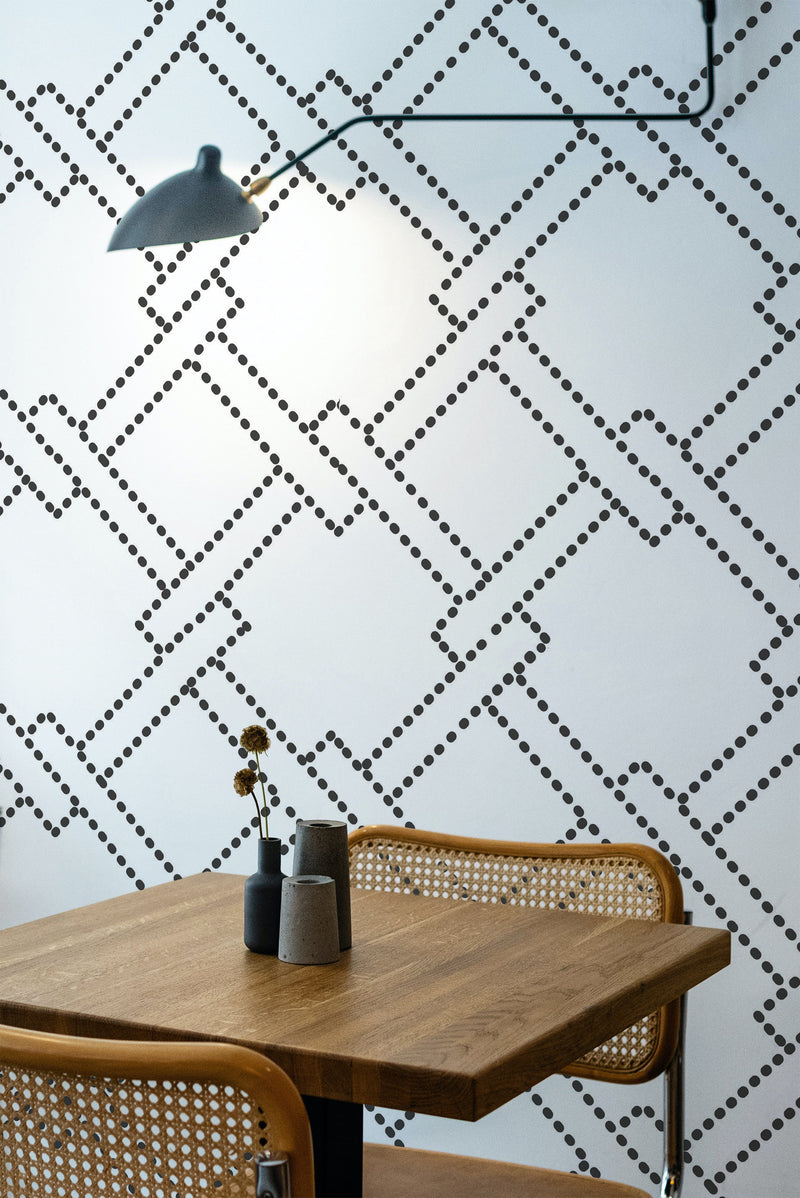 wooden dining table rattan chairs dotted geometric peel and stick wallpaper