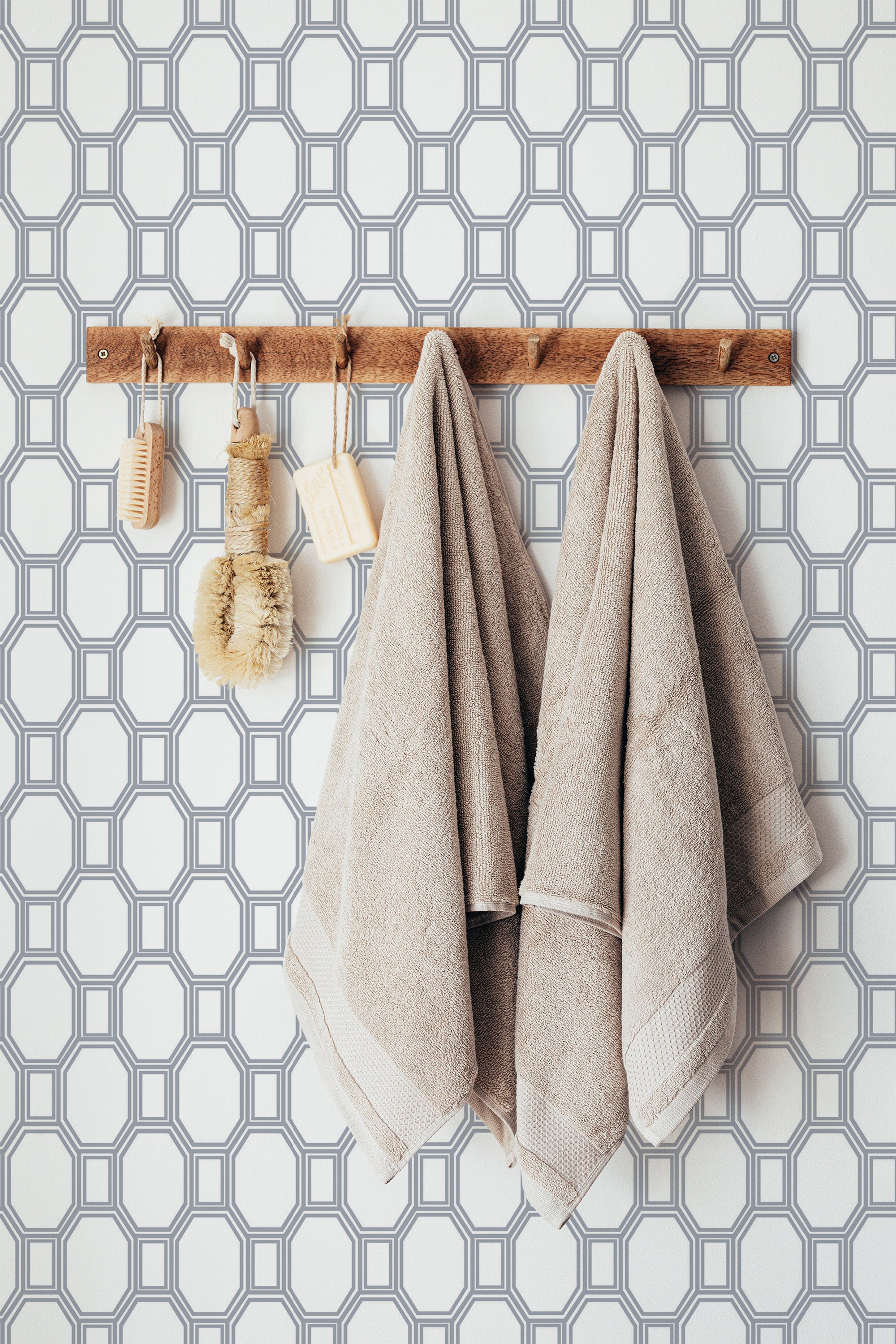 Self-adhesive wallpaper with a Farmhouse geometric design in a pattern of repeated hexagons and squares, providing a simple yet stylish look in neutral tones.