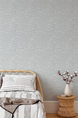 Self-adhesive wallpaper with a wave pattern in subtle, intertwining lines creating a soothing, organic flow.