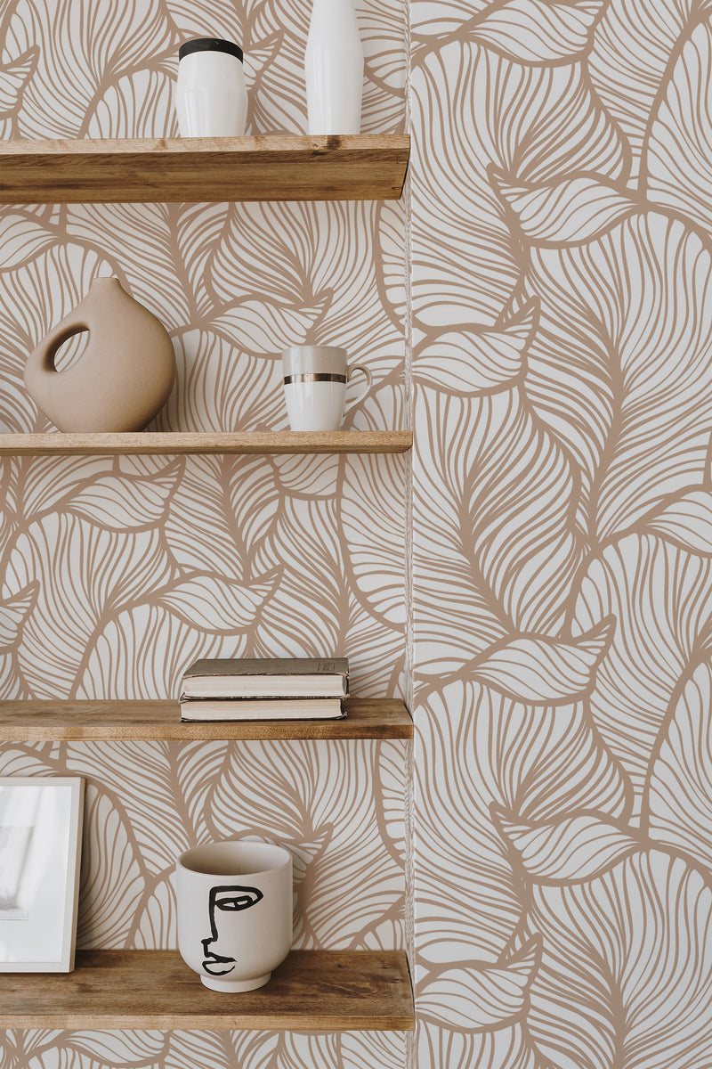 Self-adhesive wallpaper with a striped leaf design in shades of soft beige and cream creates a natural and modern aesthetic.