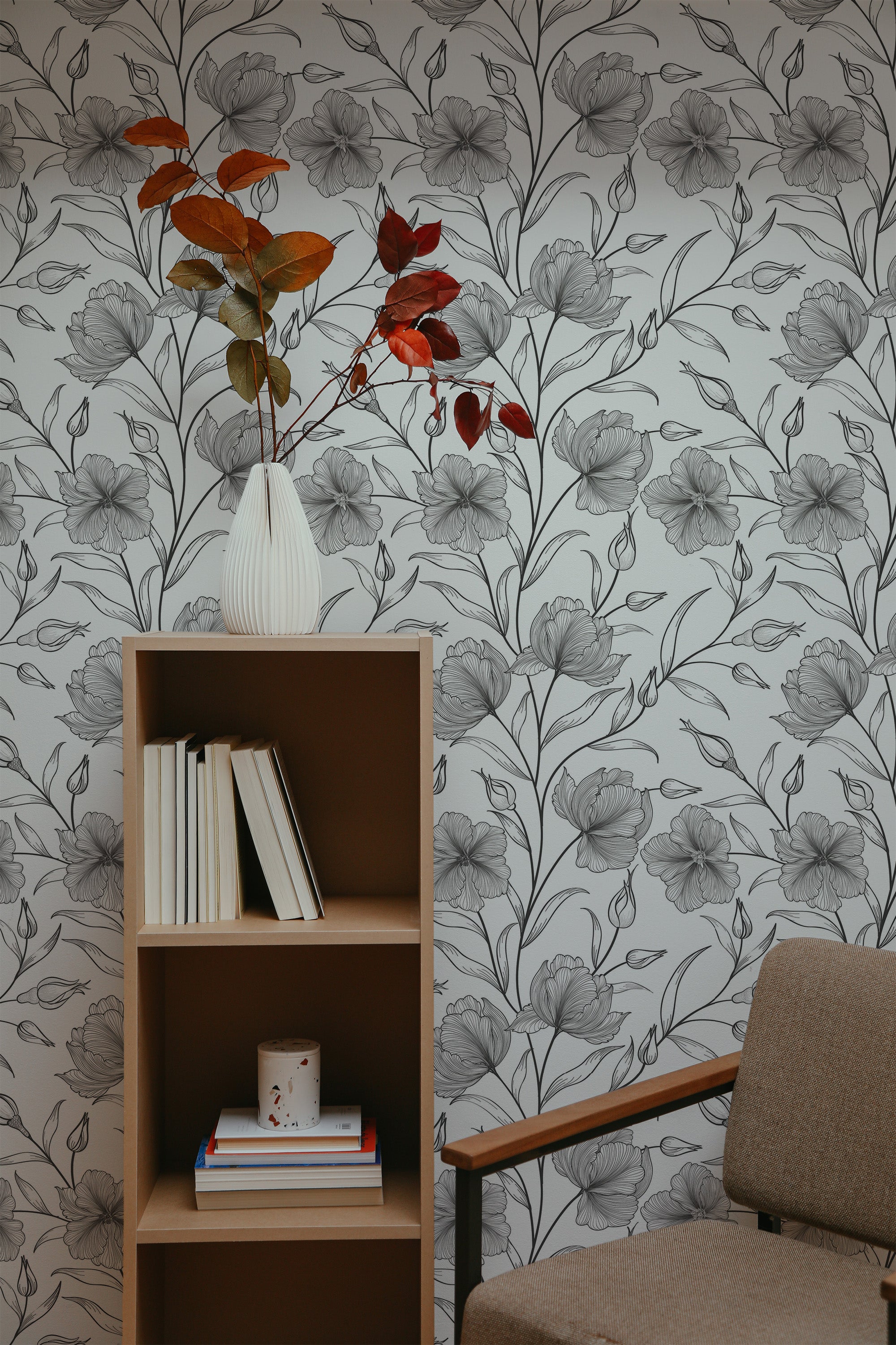 Self-adhesive wallpaper with large, intricately drawn floral patterns in grayscale, creating a sophisticated, modern look in the room.