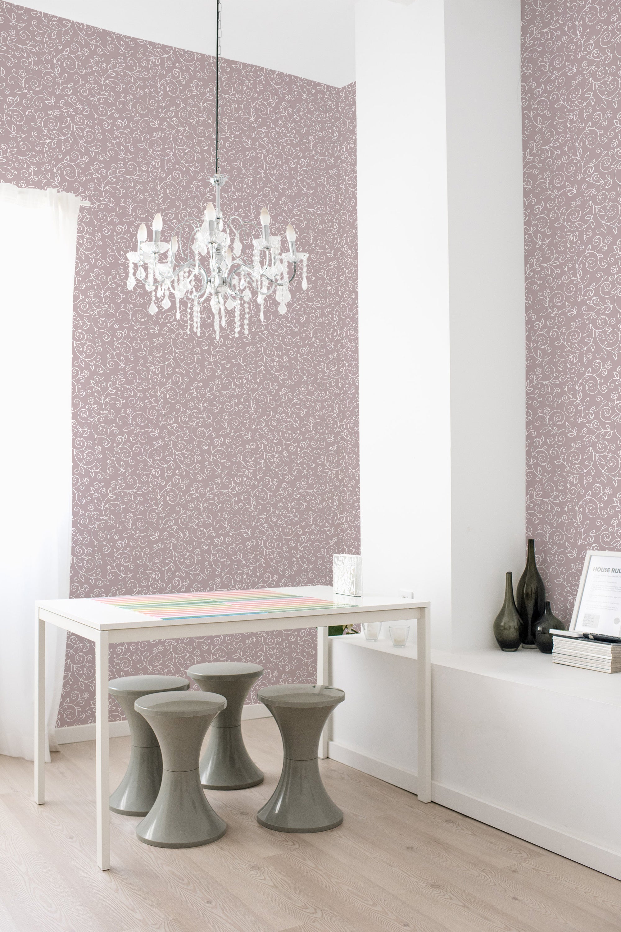 A room with soft pink wallpaper adorned with delicate, vintage-style floral patterns, adding a charming and classic touch to the space. Traditional wallpaper.