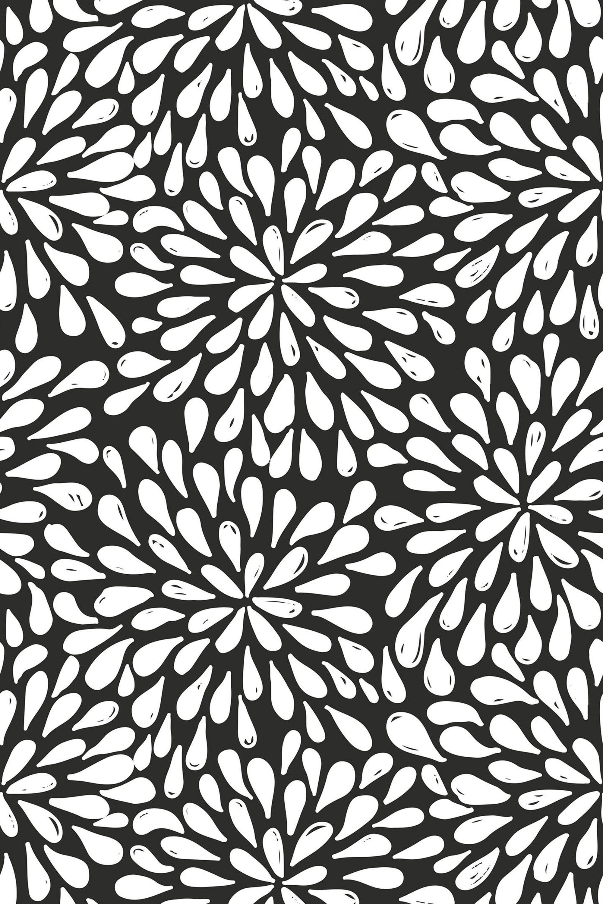 Bold abstract floral pattern with white petal-like shapes radiating from central points on a black background, creating a dynamic and modern look. Peel and stick removable wallpaper.