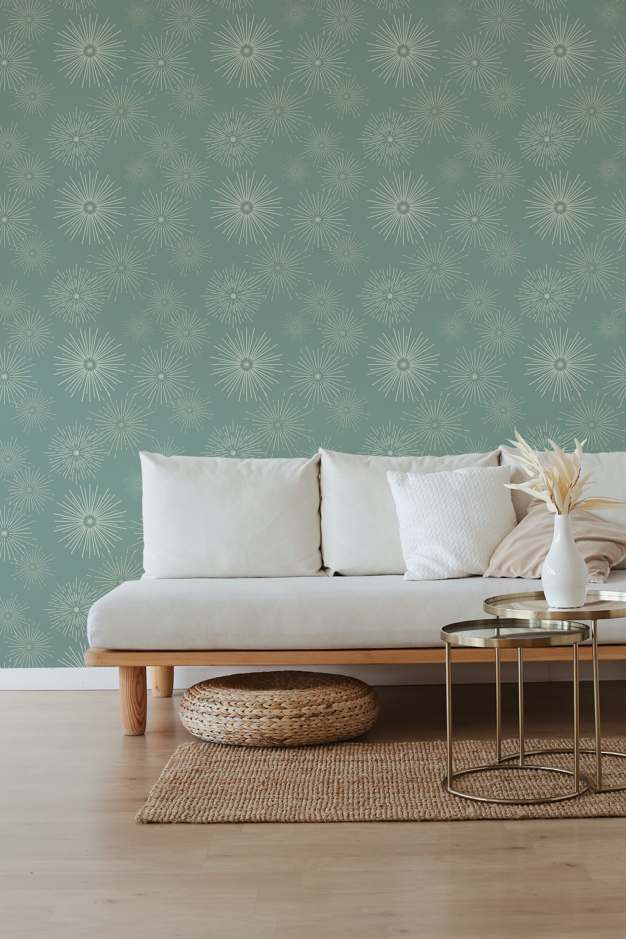Green wallpaper with a pattern of small, intricate starburst designs evenly spaced across the wall, creating a subtle and elegant look in a cozy room. Traditional wallpaper.