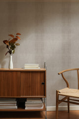 Self-adhesive wallpaper mimicking crocodile skin texture in a subtle, taupe-gray shade, adding a sophisticated and natural touch to the room���s ambiance.