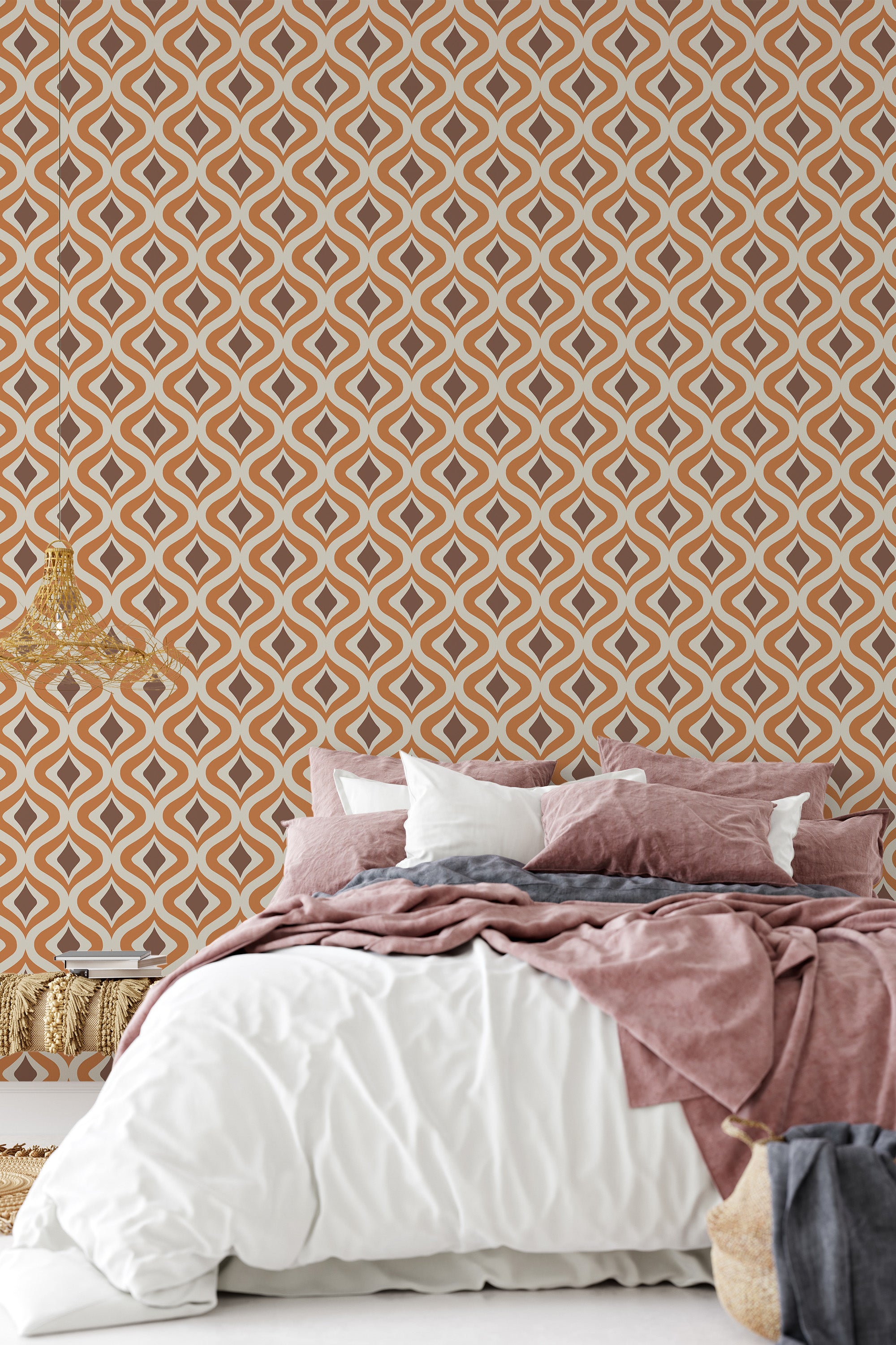 Retro orange wallpaper with a repetitive geometric pattern of interlocking diamond shapes in a cream and orange color scheme, creating a bold, nostalgic atmosphere in the room. Traditional wallpaper.