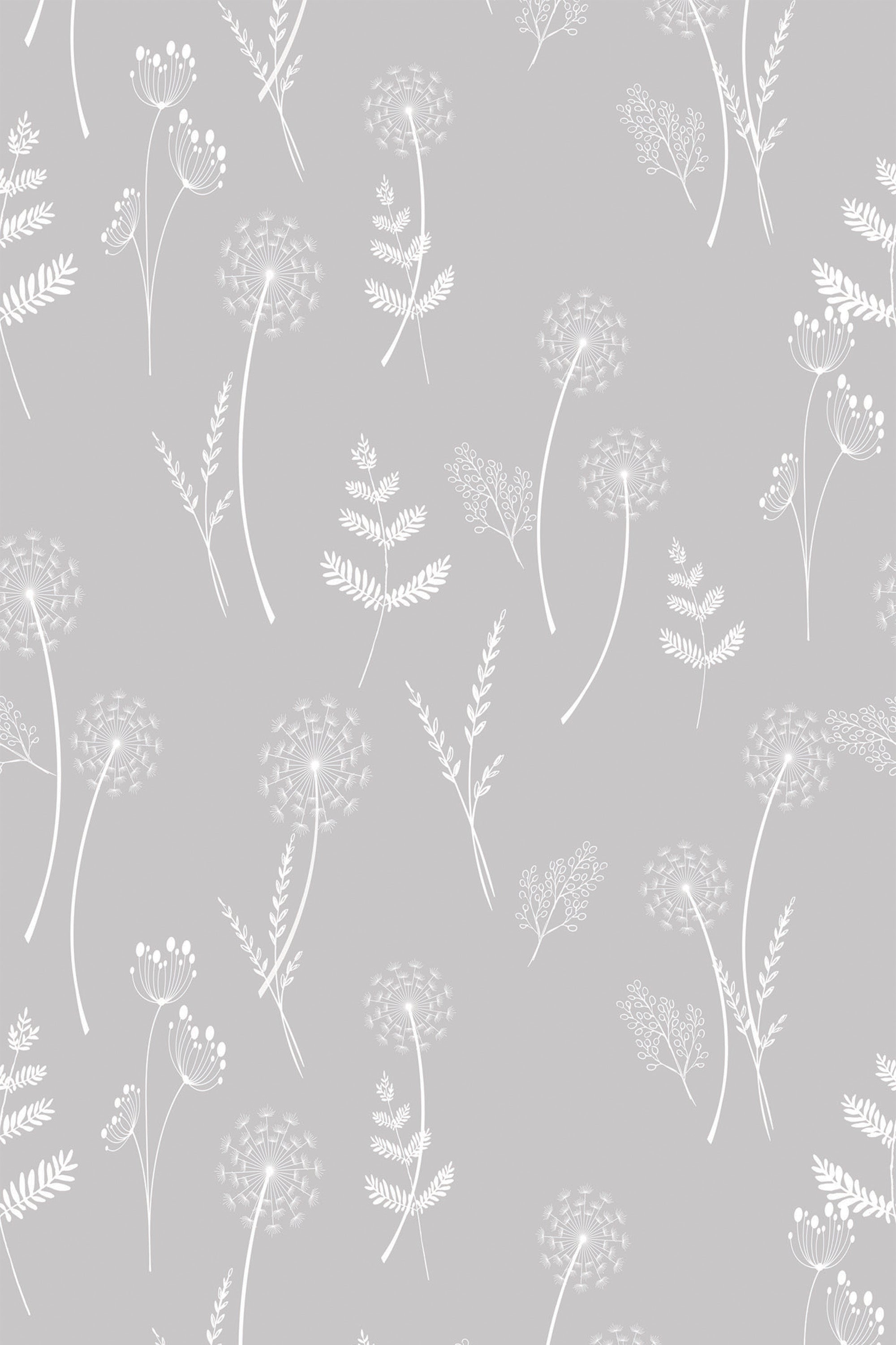 A gray background with delicate, white, hand-drawn dandelions and various botanical elements creating a soft, whimsical pattern. Peel and stick removable wallpaper.