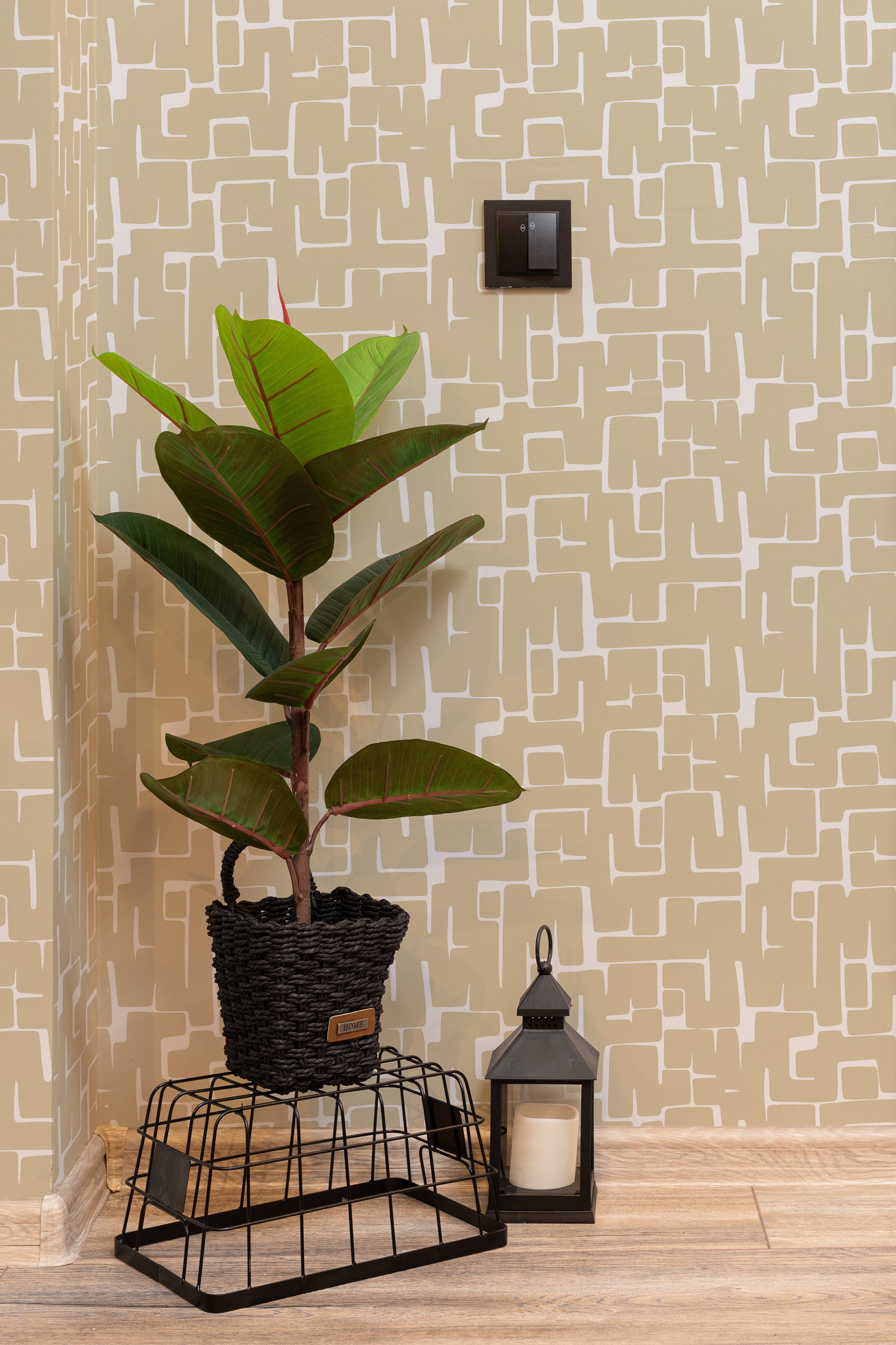Self-adhesive wallpaper with a minimalist brush stroke pattern in a room with a potted plant and lantern on a wooden floor.