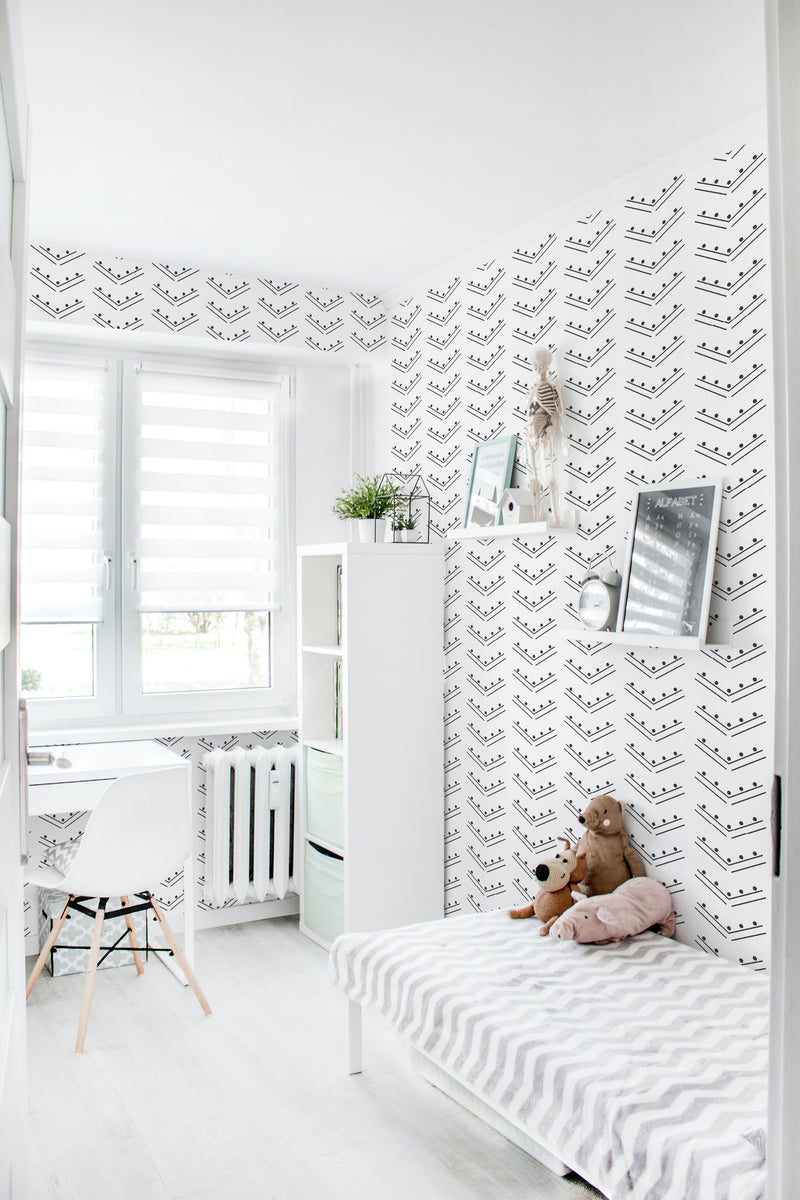 A bright room with walls covered in herringbone dots patterned wallpaper, combining clean lines and simple dots in a monochrome color scheme, giving a modern twist to traditional wallpaper.