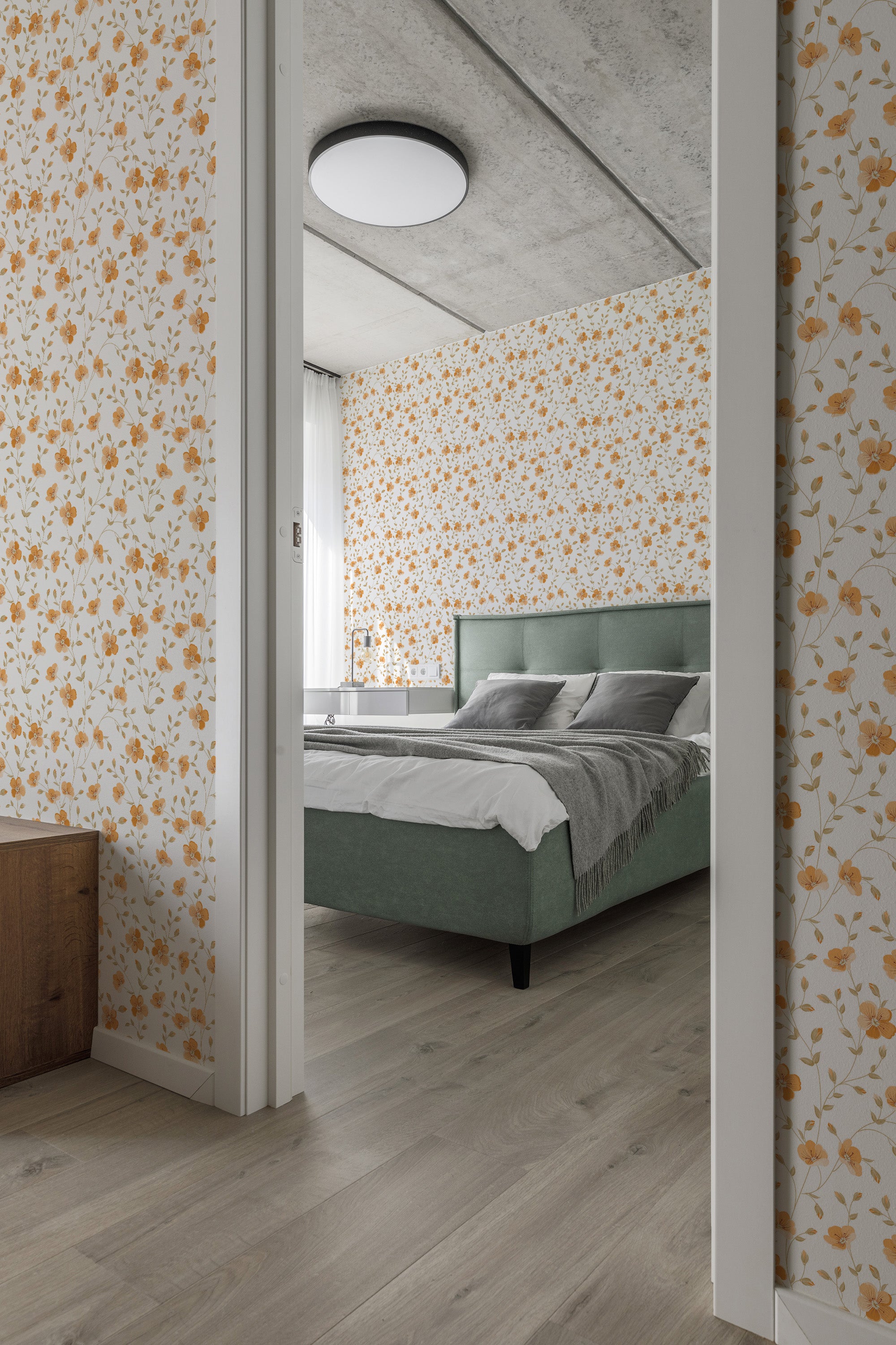 A bedroom with one wall adorned in traditional wallpaper with an orange floral pattern on a pale background.