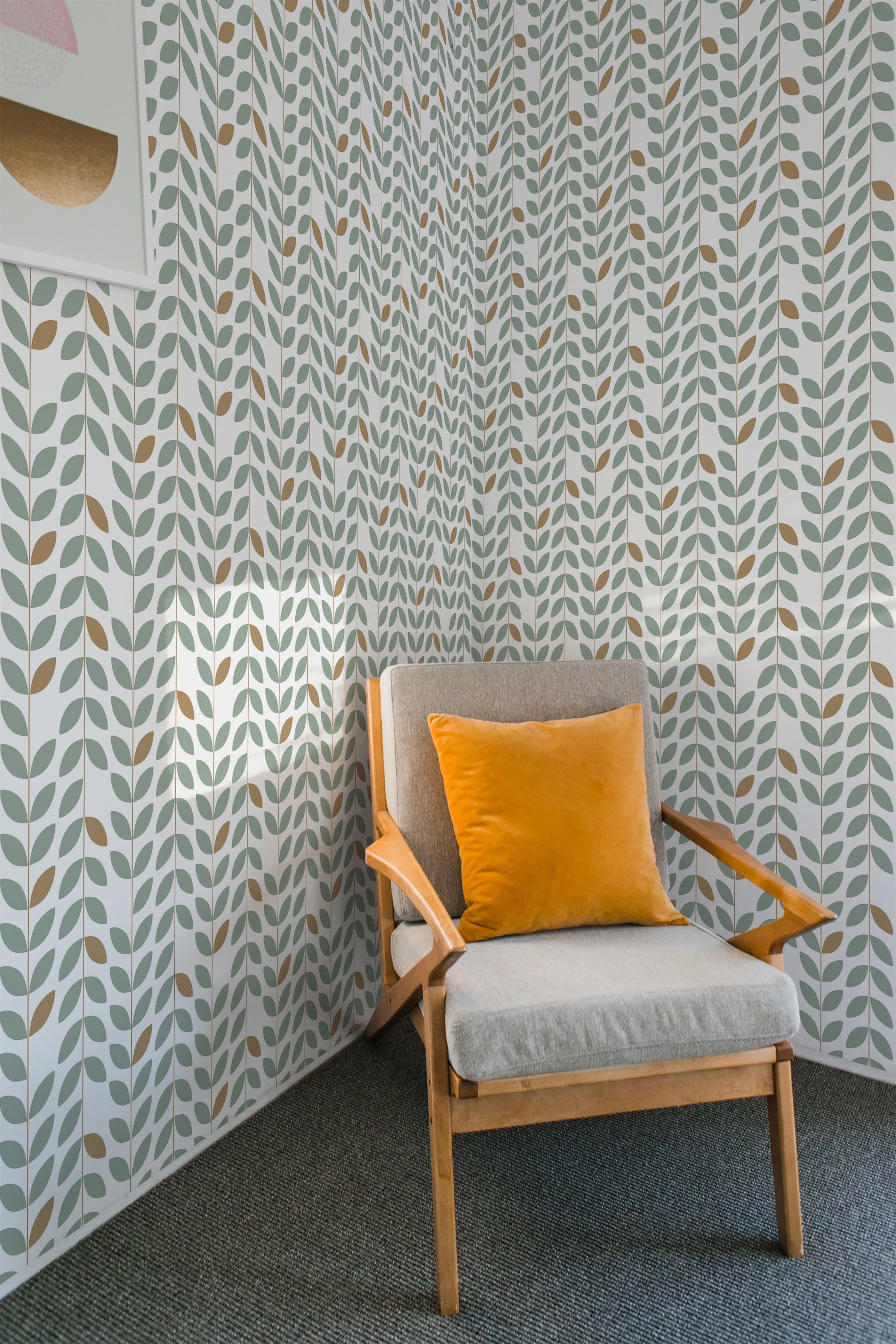 A Mid-century stripe wallpaper with a pattern of stylized grey and green leaves against a white background, behind a wooden chair with a yellow cushion, embodying a retro aesthetic in traditional wallpaper.