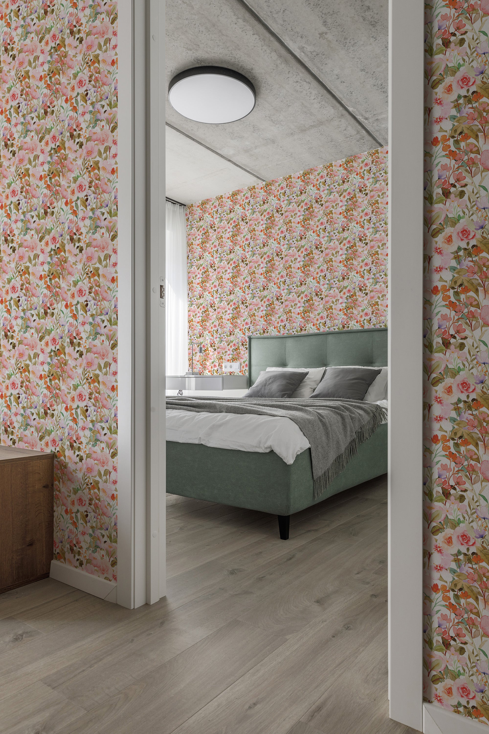 A bedroom with Pink spring floral wallpaper with blossoming trees and various flowers in shades of pink and green on a cream background, complemented by a green bedspread, traditional wallpaper.